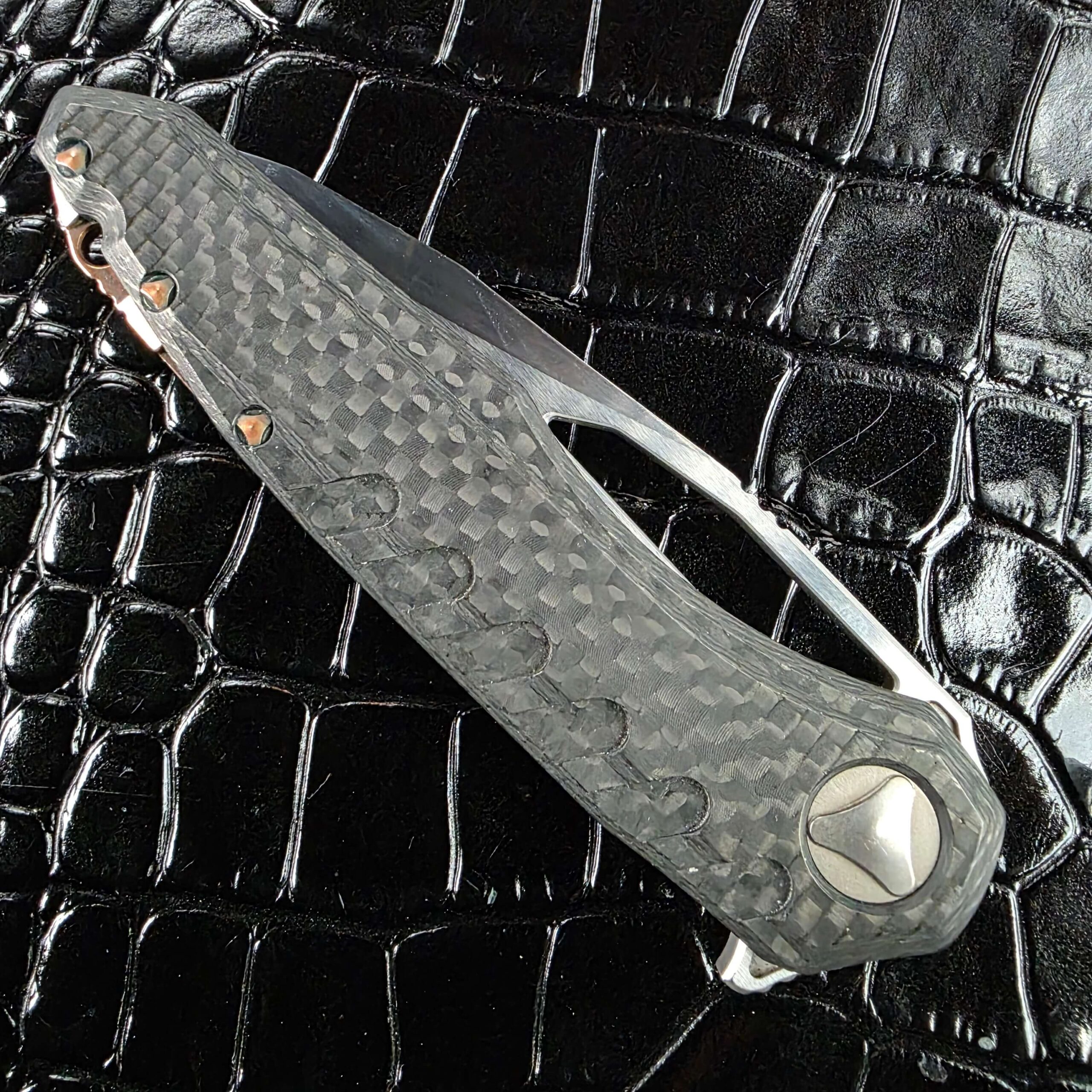 3D milled dimpled texture in the carbon fiber frame of the Marfione Custom Sigil