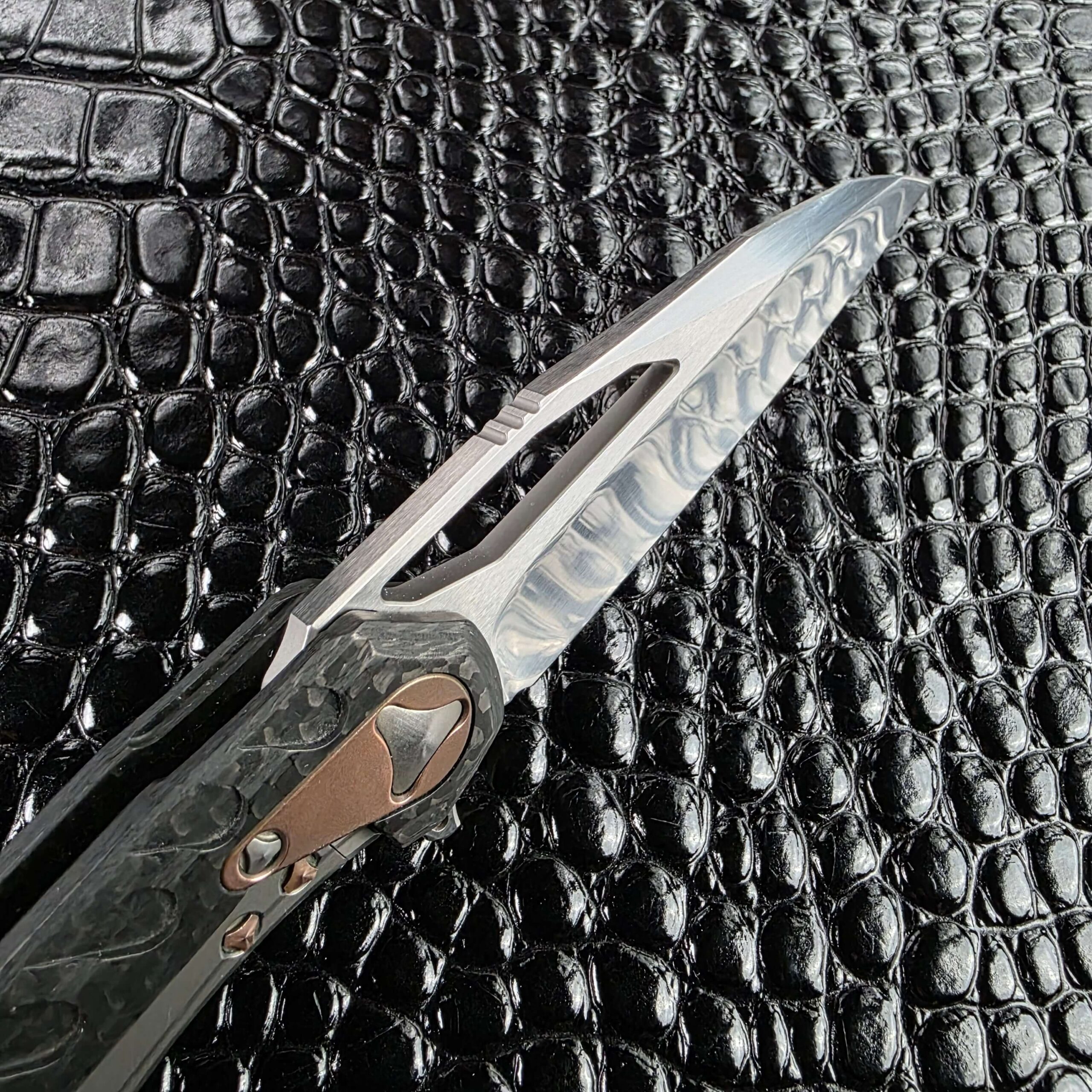 Long slot opener cut through the Marfione Custom Sigil blade