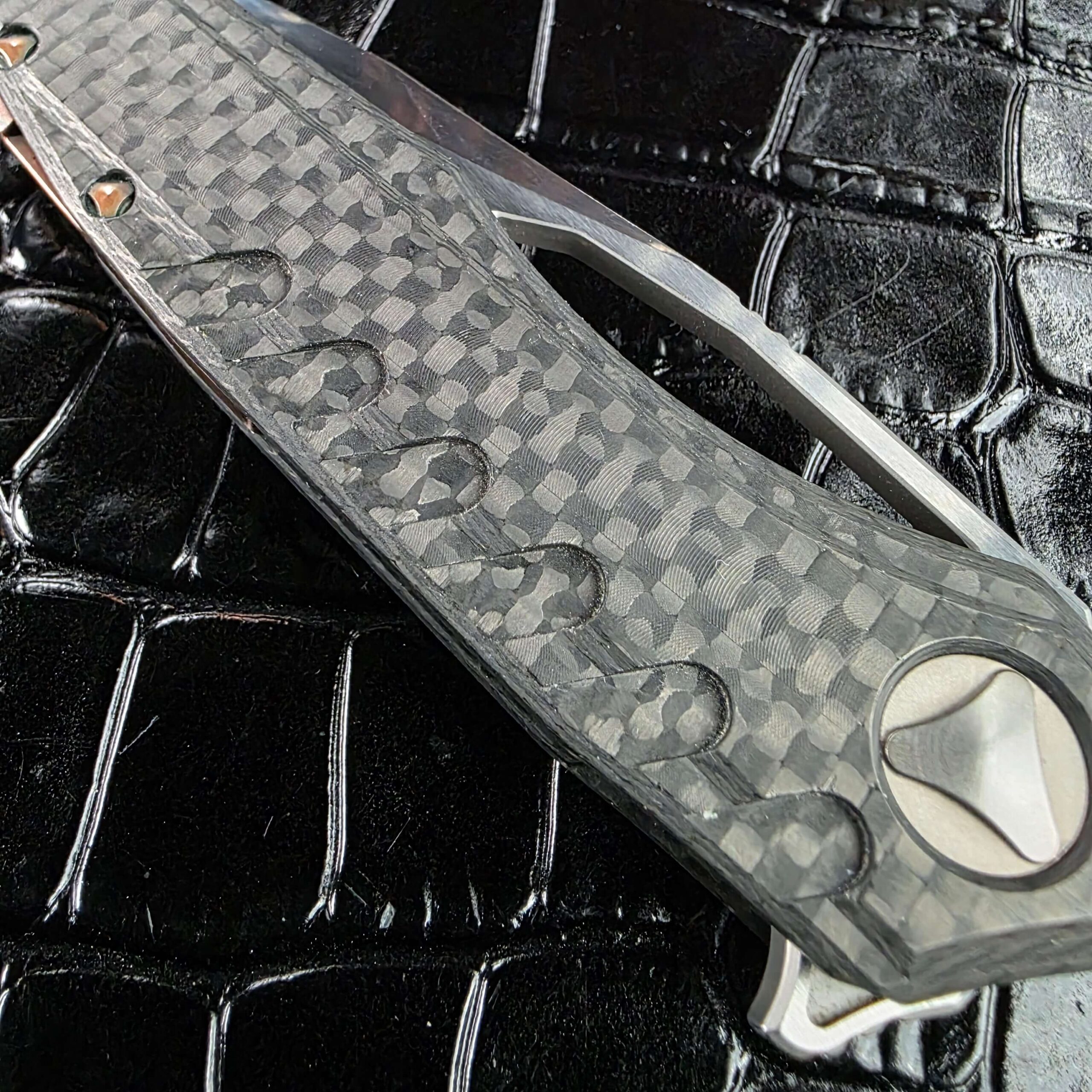 Marfione Custom Sigil closed on the show side, blade slot visible through the frame