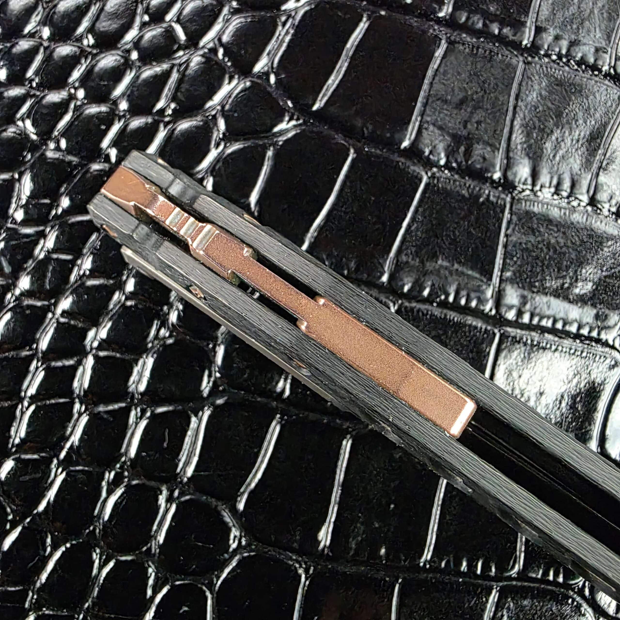 Copper backspacer along the spine of the Marfione Custom Sigil with integrated lanyard loop