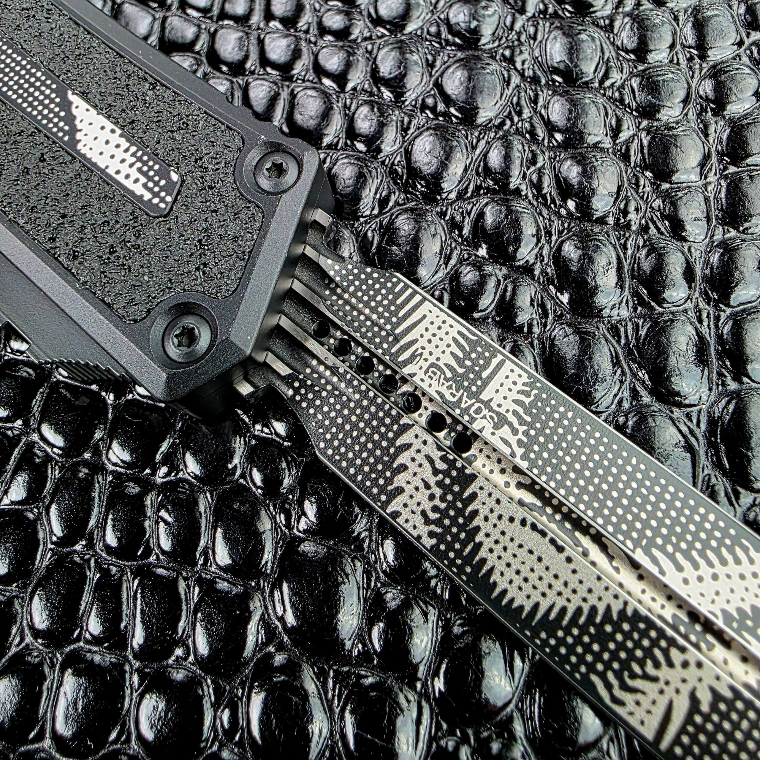 Blade exit and handle junction on the Microtech Scarab II Gen III OTF