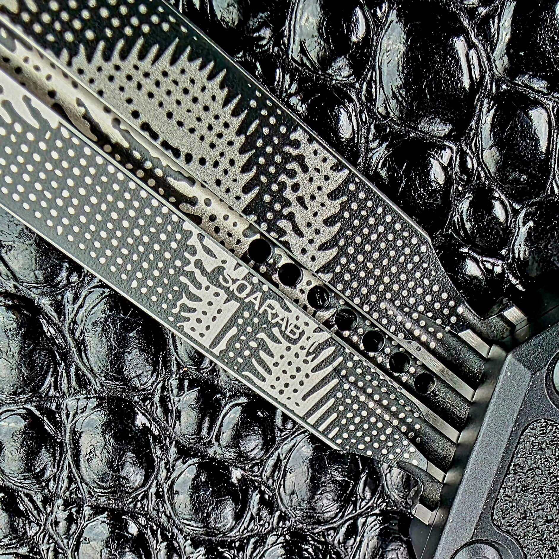 Microtech and Scarab markings etched on the M390MK blade of the Scarab II Gen III