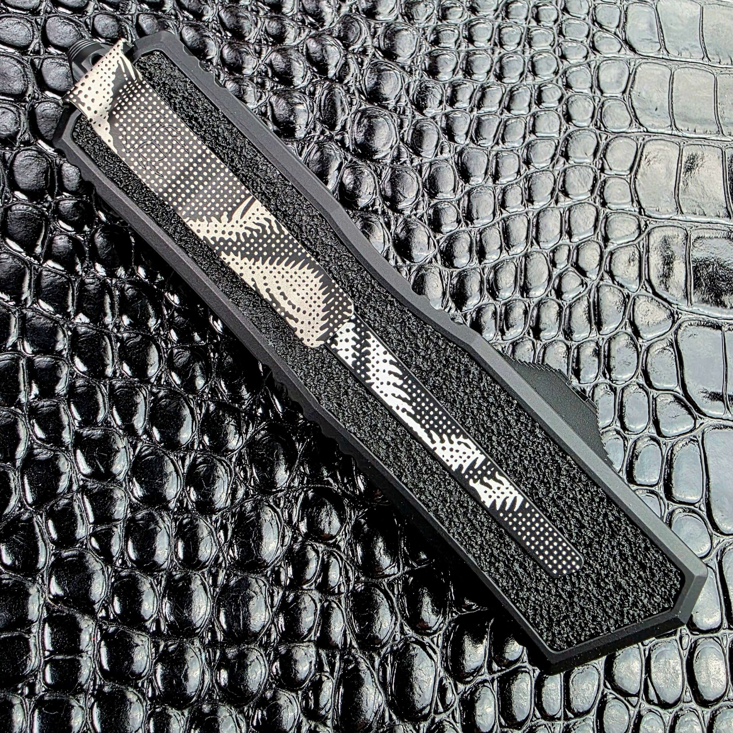 Microtech Scarab II Gen III closed on the clip side with the reversible steel pocket clip