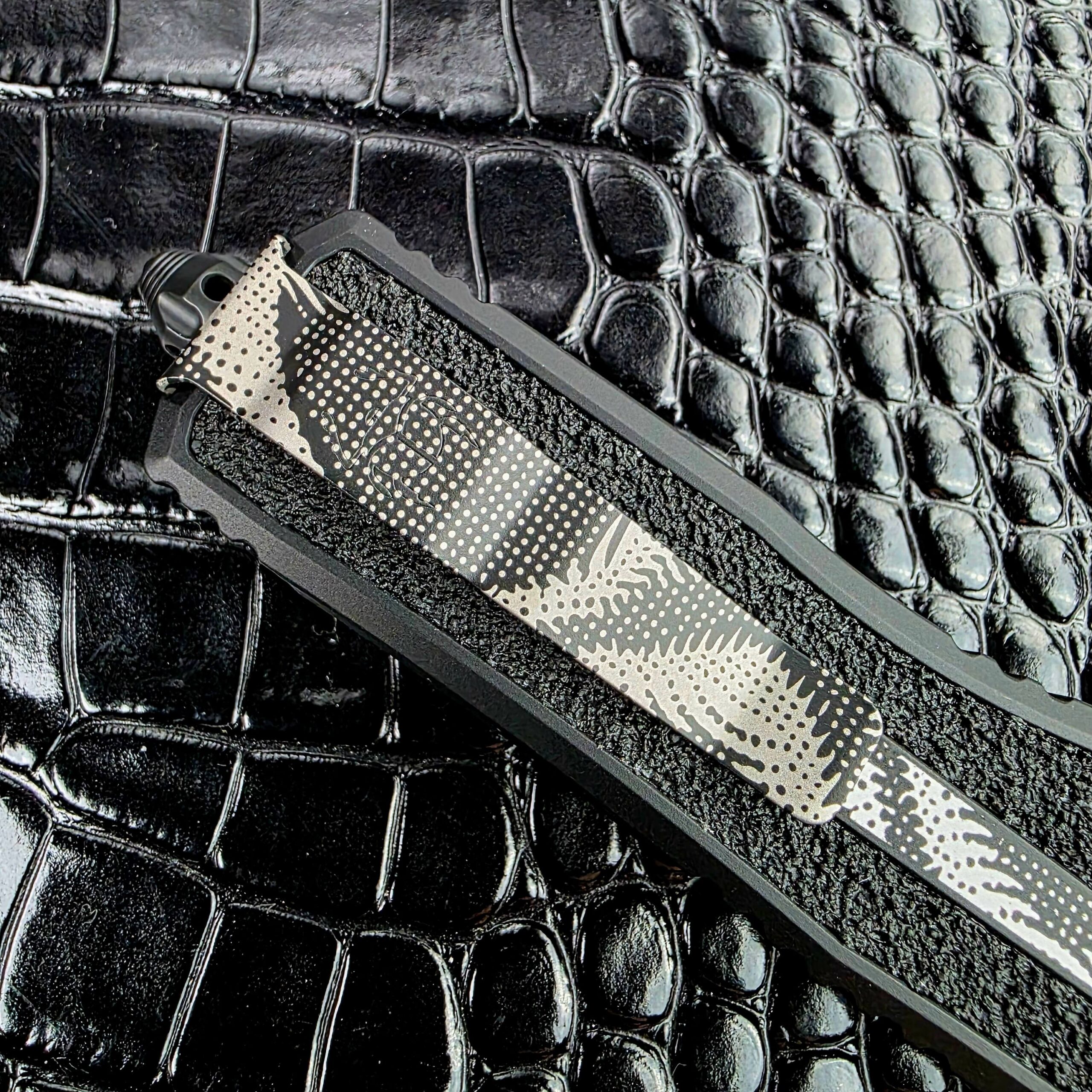Three-quarter view of the closed Microtech Scarab II Gen III showing the chamfered handle edges