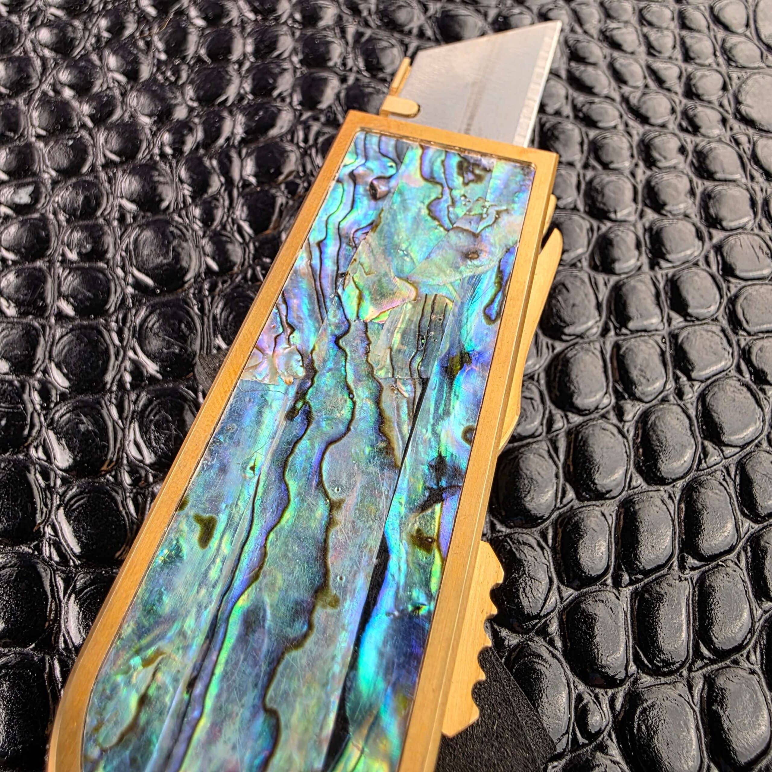 Blade deployed from the front of the Miroc Razor Knife OTF Automatic Custom
