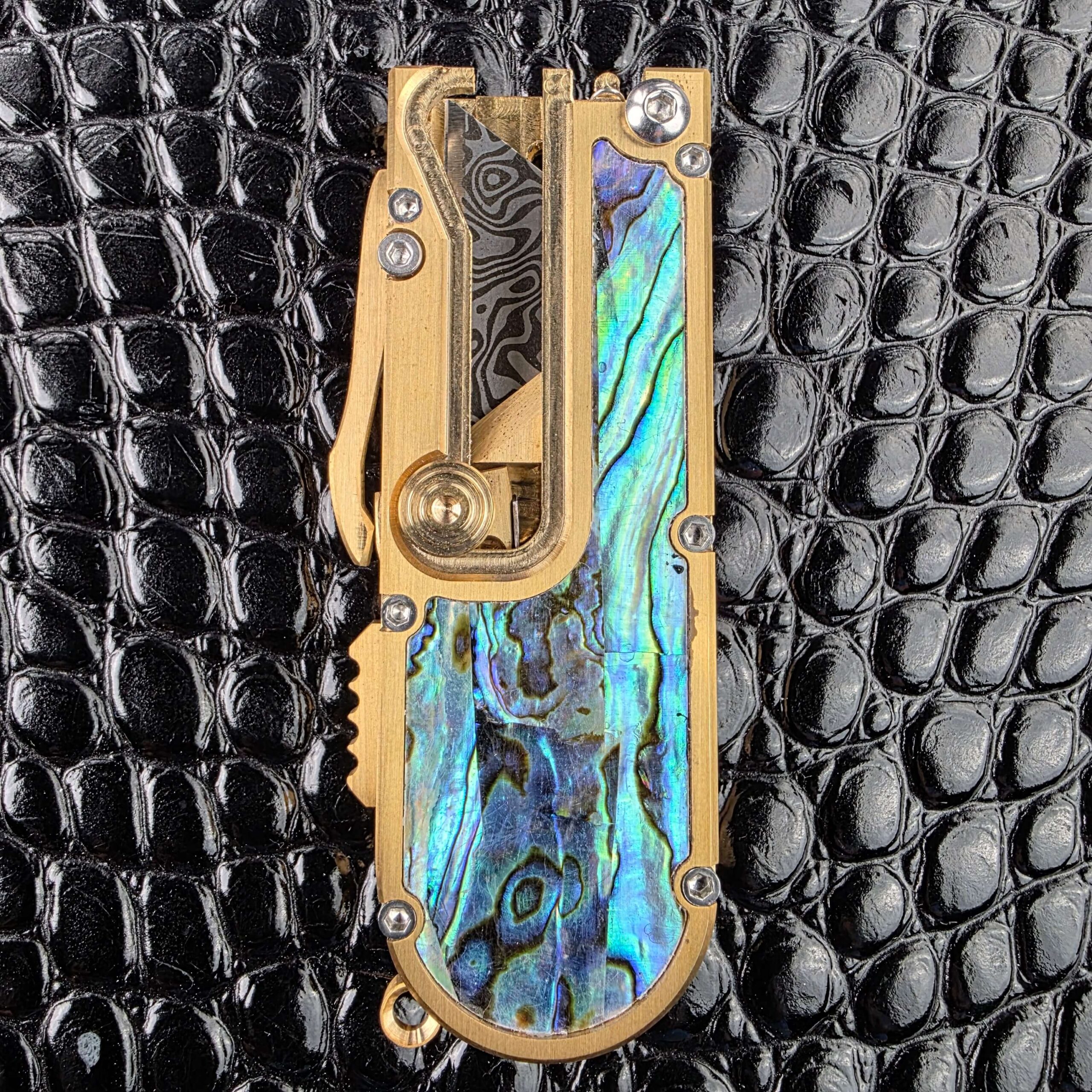 Machined brass chassis and hardware on the Miroc Razor Knife