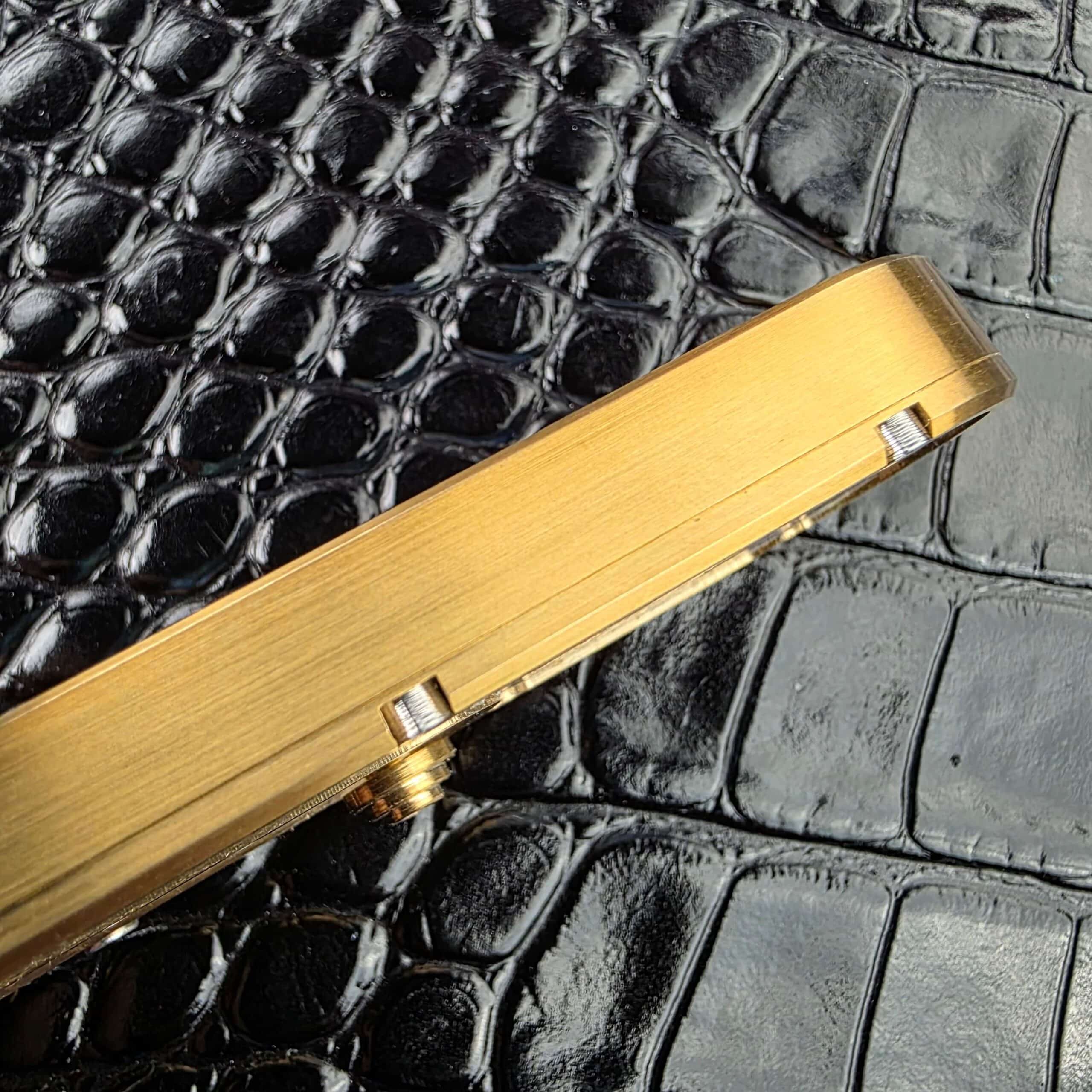 Brushed brass spine and lanyard hole on the Miroc Razor Knife