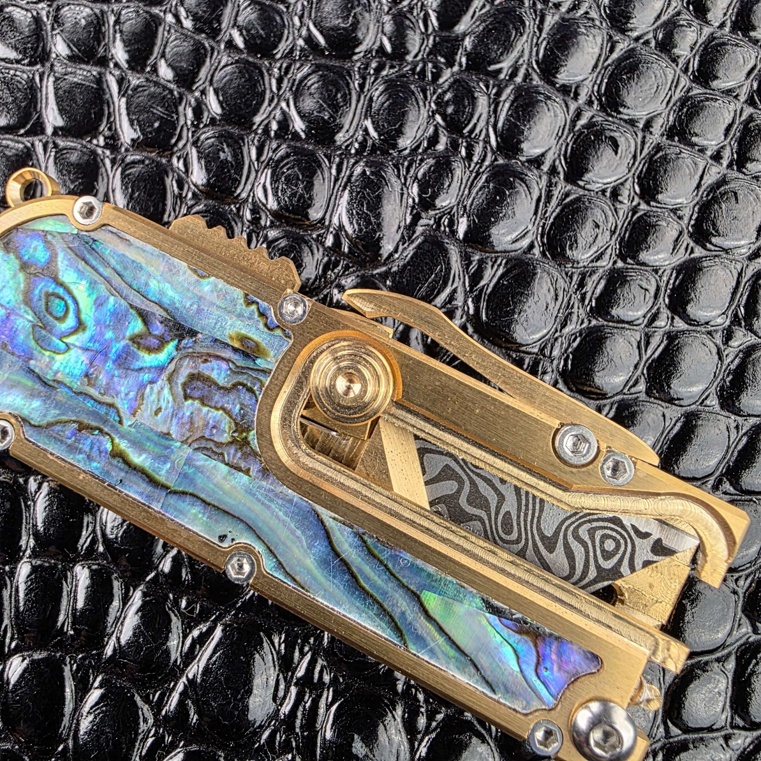 Internal spring mechanism visible on the Miroc Razor Knife OTF Automatic Custom