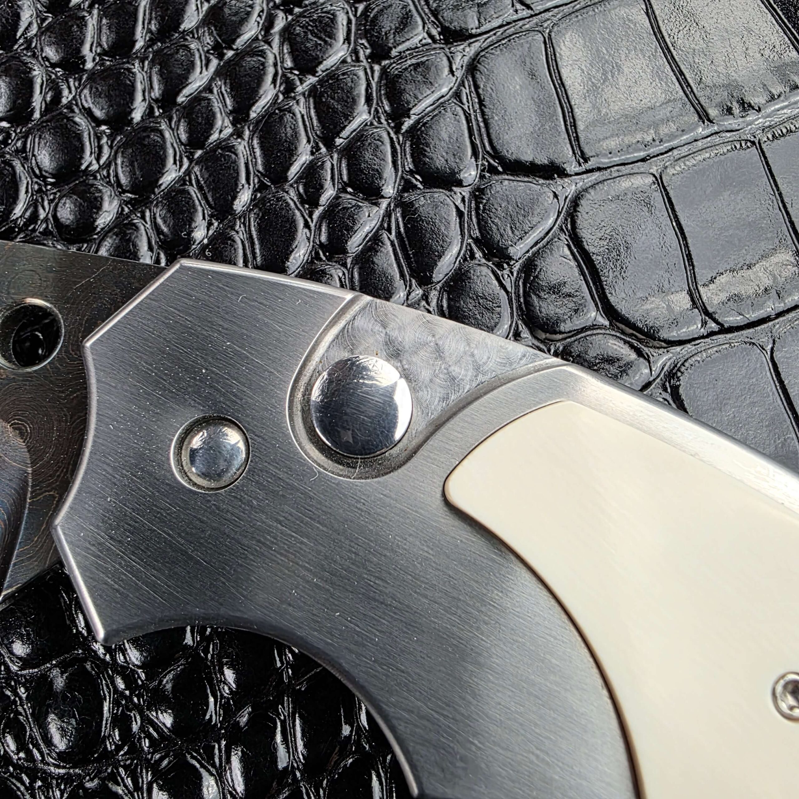 Domed firing button with a stamped mark on the Reese Weiland Large Rastor