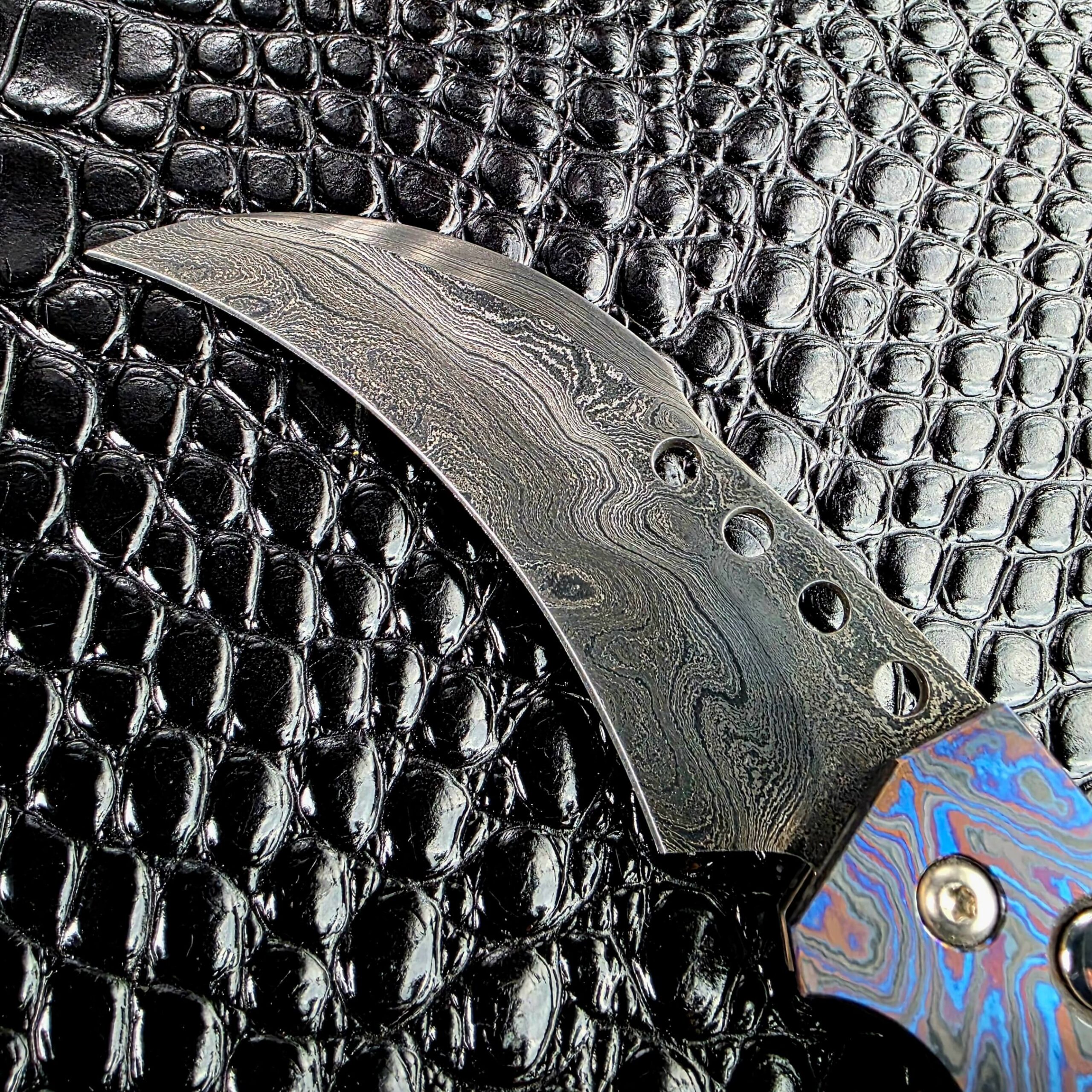 Damascus pattern on the Reese Weiland hawkbill blade, forged in house by the maker