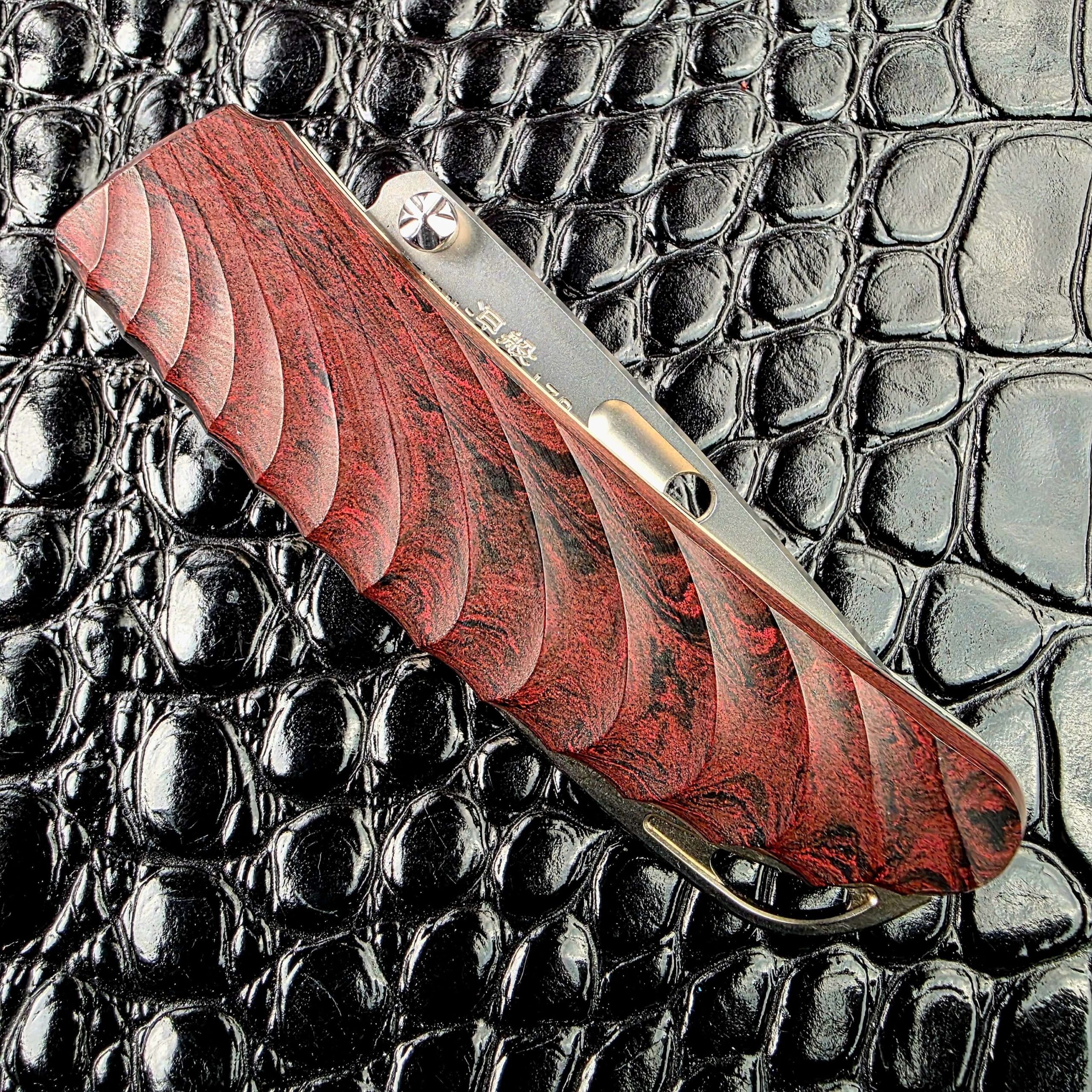 Rockstead NEHAN closed on the lock side with the milled ebonite wave pattern