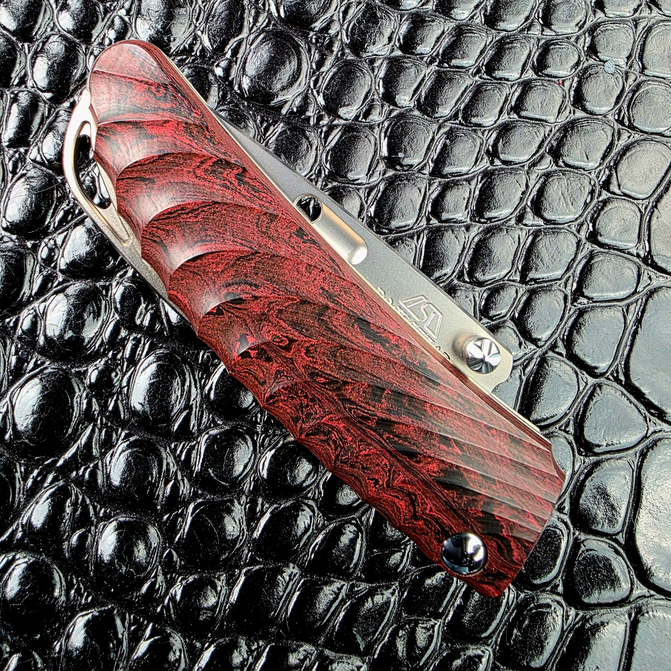 Rockstead NEHAN closed showing the ebonite scale with no visible screws