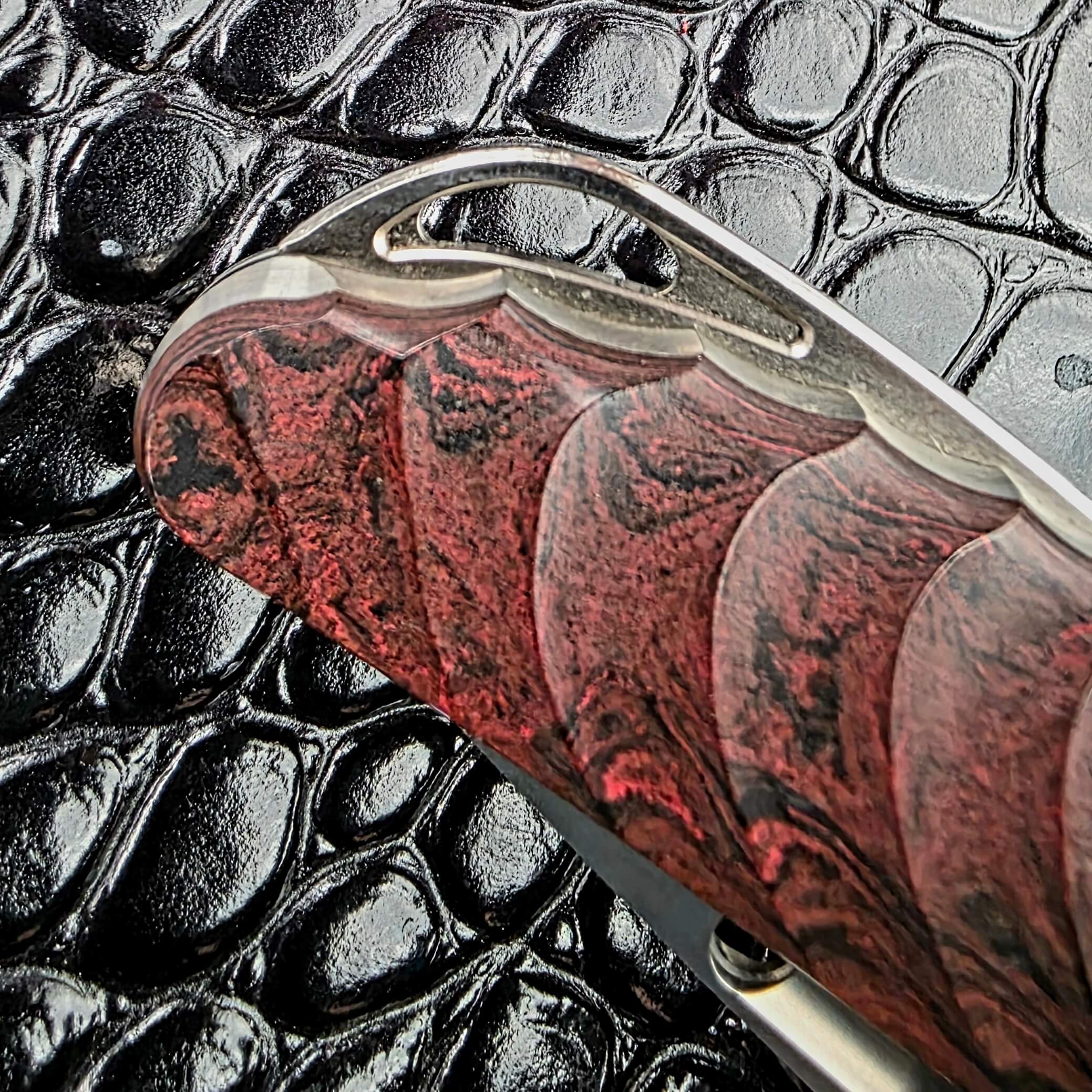Milled kimono wave pattern in the ebonite scales of the Rockstead NEHAN