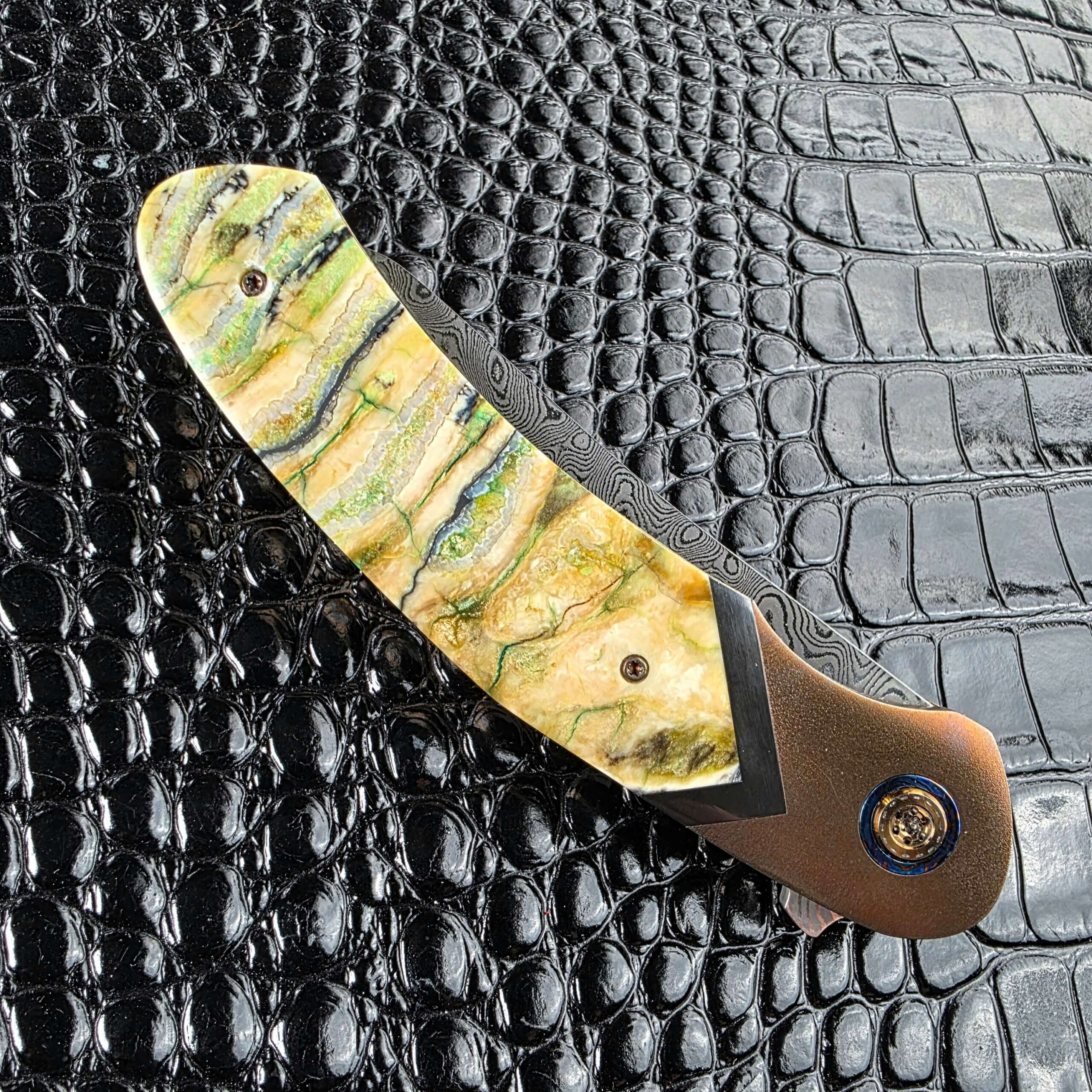 Stabilized mammoth tooth scale on the closed Andriy Mozil Model 22-26 Custom