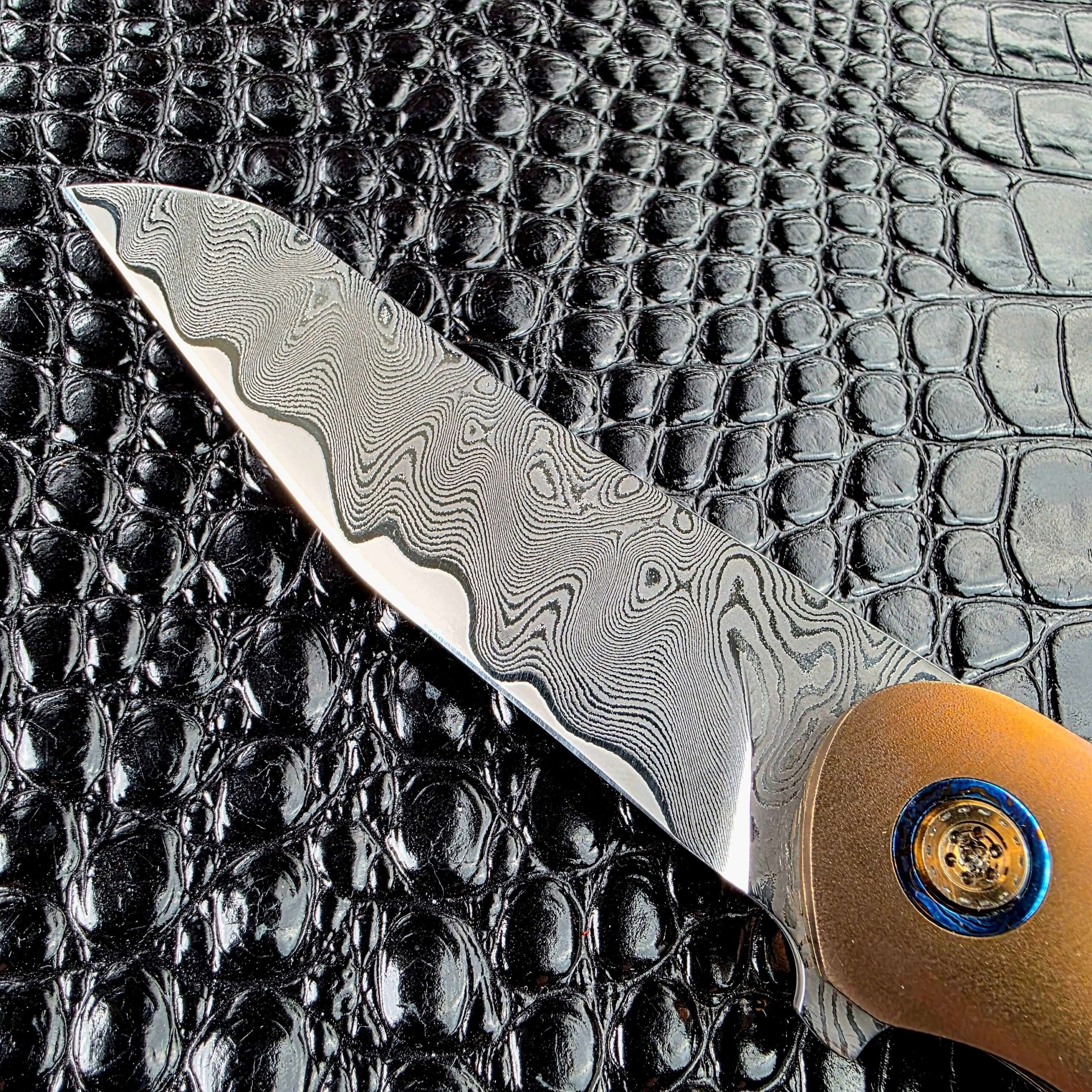 Stainless Damascus pattern on the Andriy Mozil Model 22-26 Custom blade