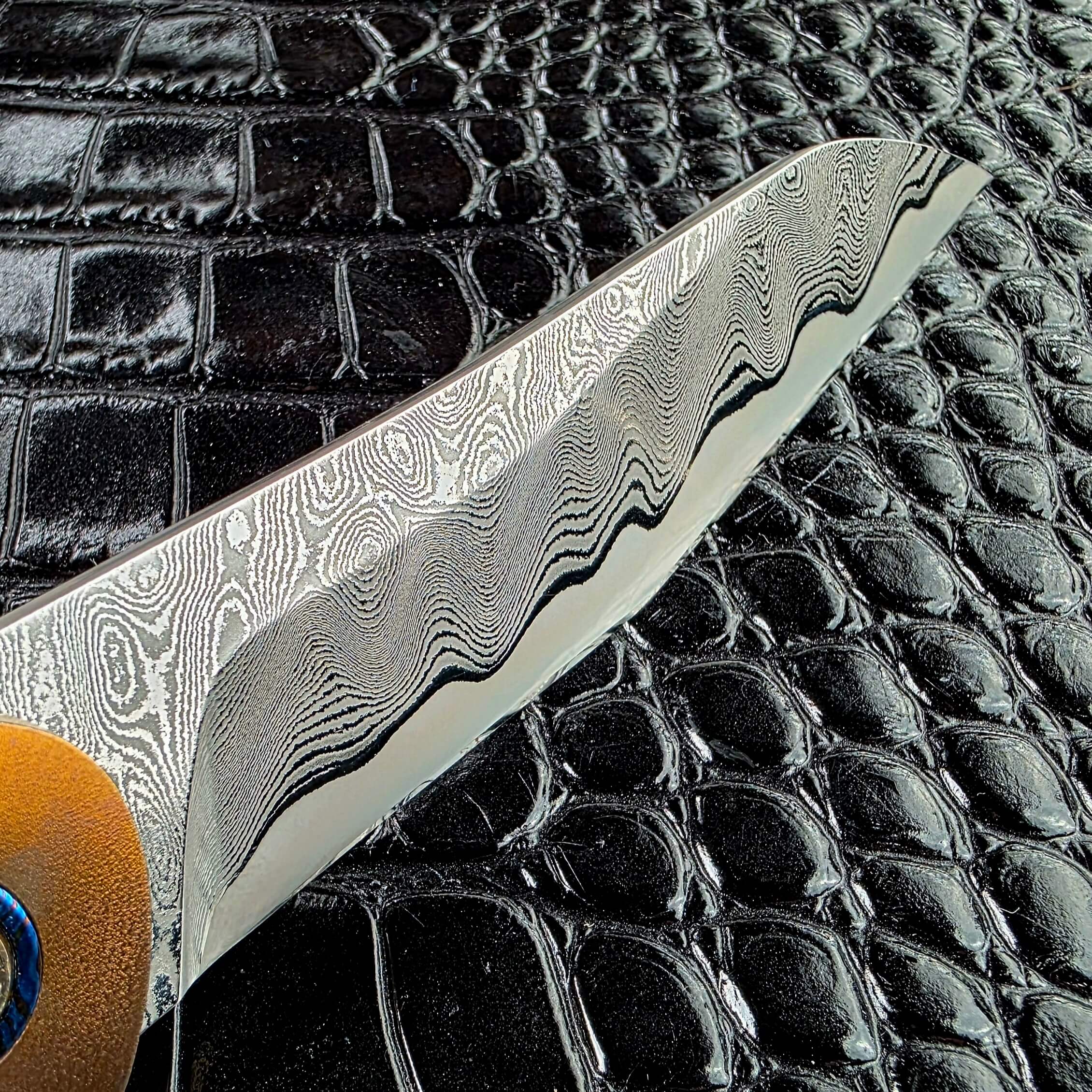 San mai lamination line where the MagnaMax core meets the Damascus jacket on the Andriy Mozil Model 22-26