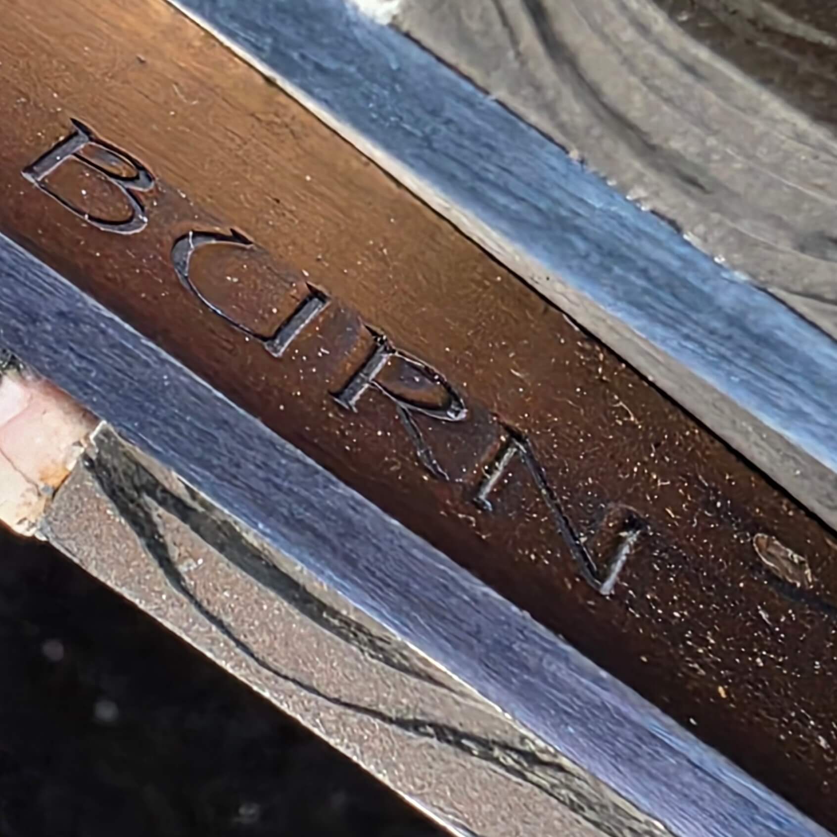 BURN maker's mark stamped into the bronze backspacer of the Paul Panak automatic dagger