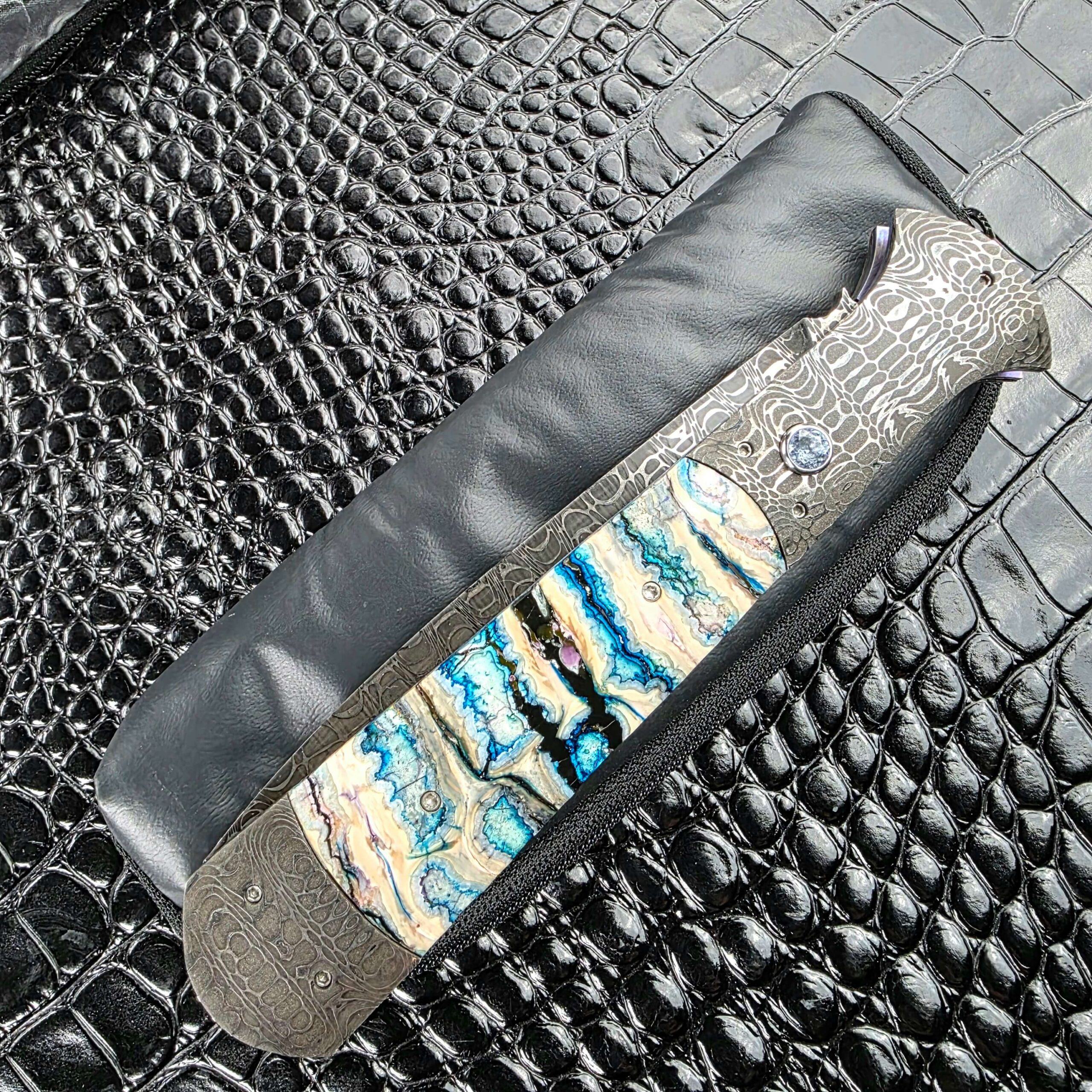 Burn Knives Automatic Dagger closed on its soft case