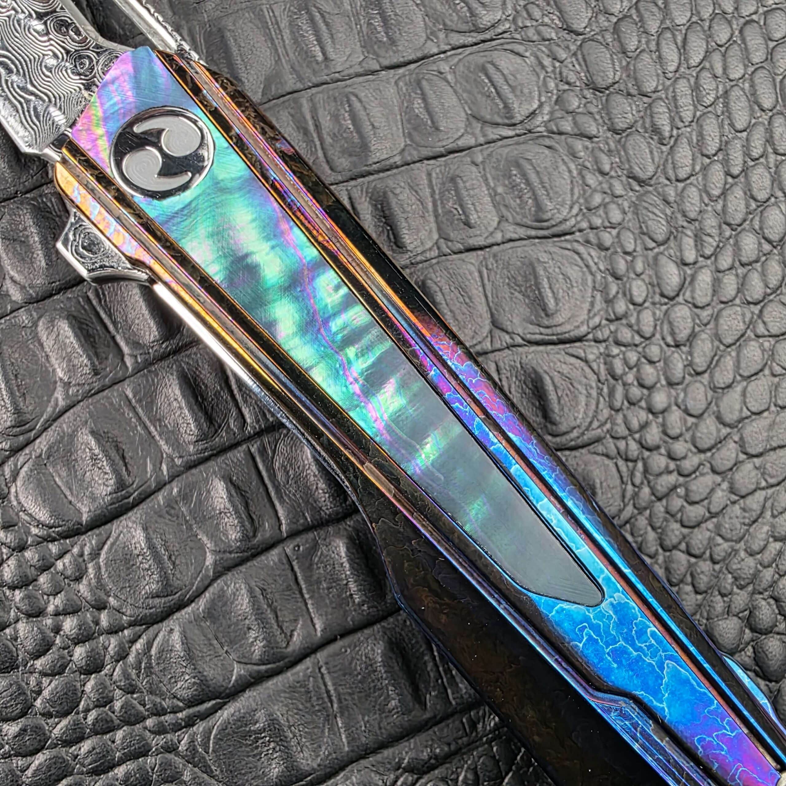 Blacked Abalone inlay and Cosmic Storm Titanium on the handle of the Dew Hara Kabuki