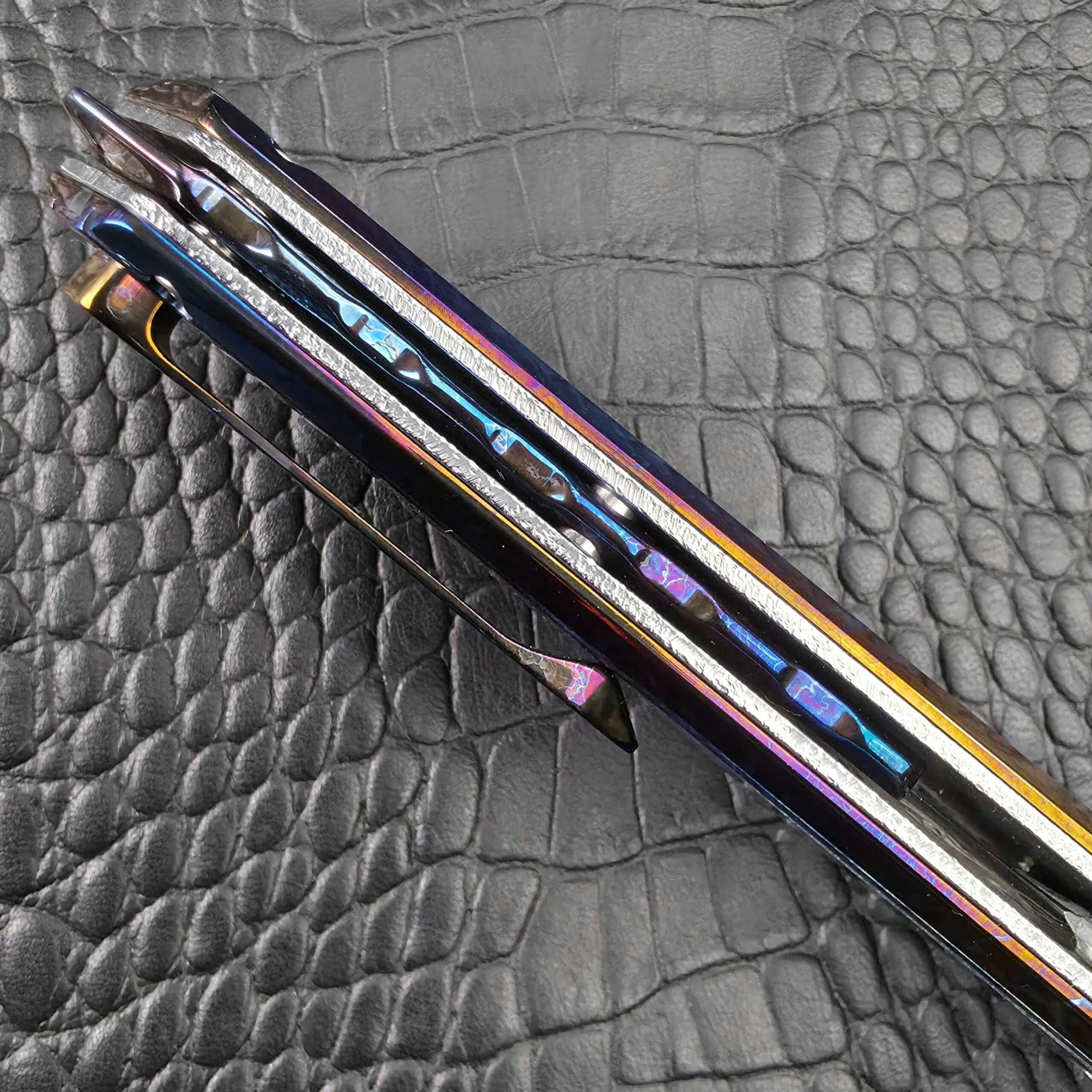 Spine view of the Dew Hara Kabuki showing the jimped Cosmic Storm Titanium backbar