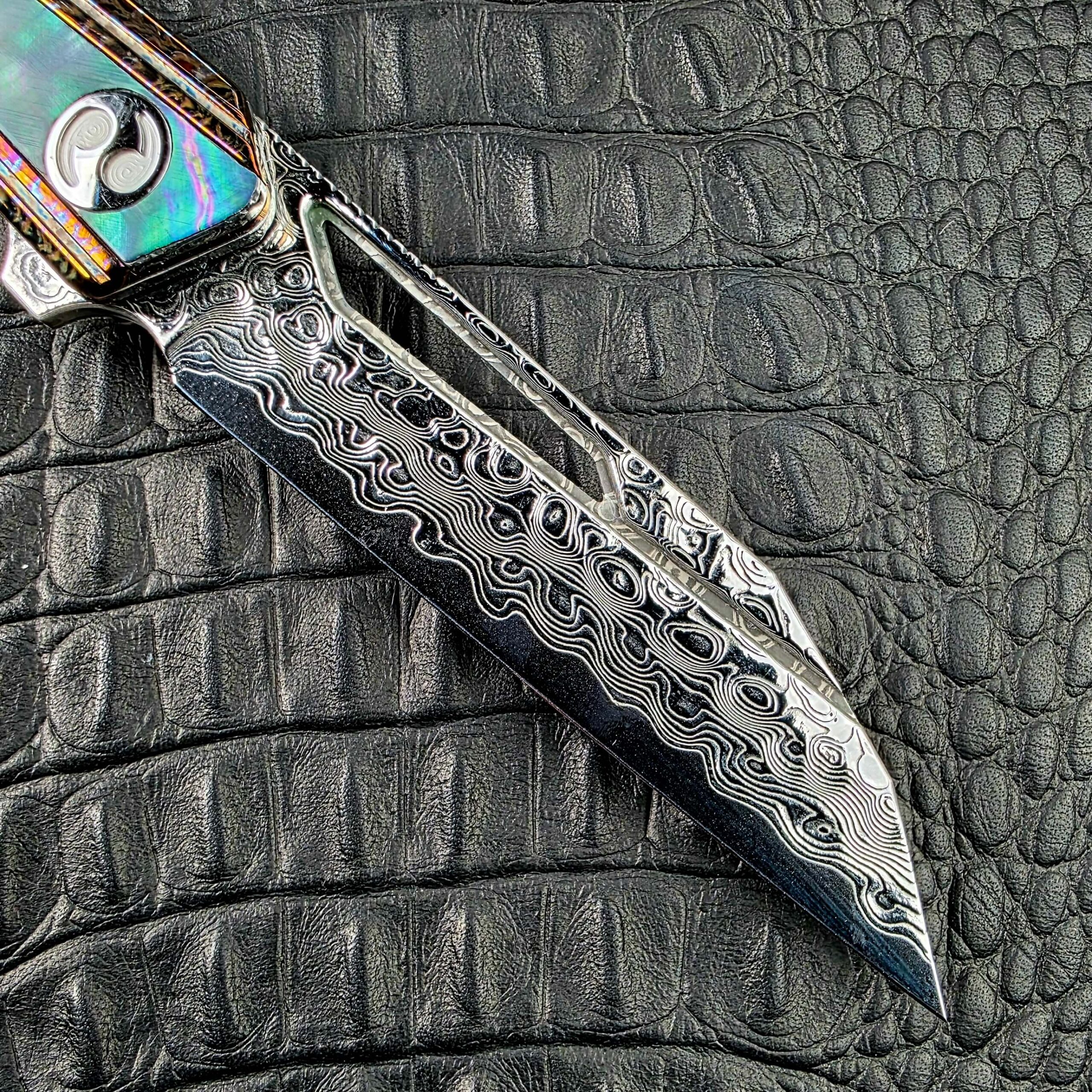 Elongated window milled through the Damascus blade of the Dew Hara Kabuki