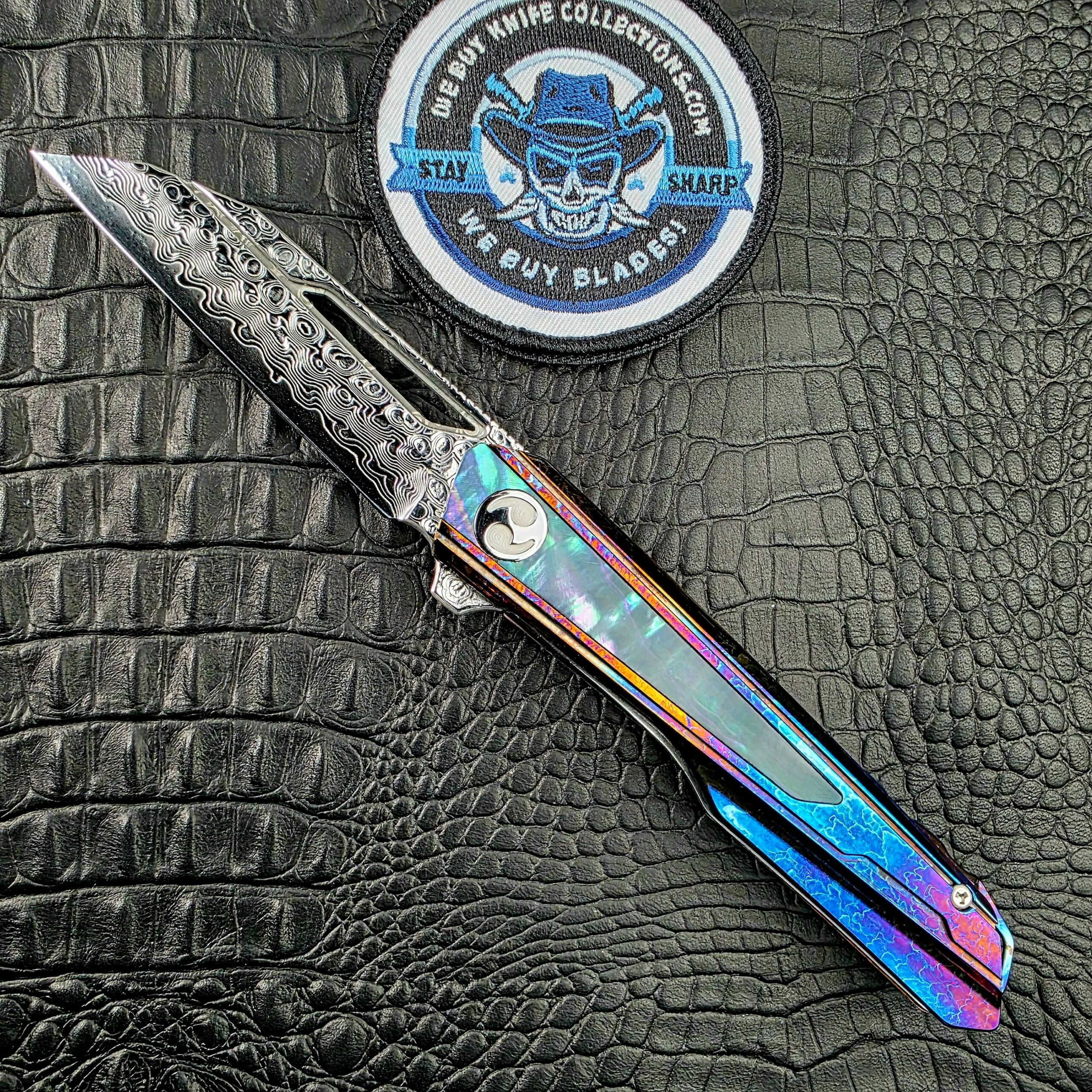 Dew Hara Kabuki open on its show side beside the We Buy Knife Collections patch