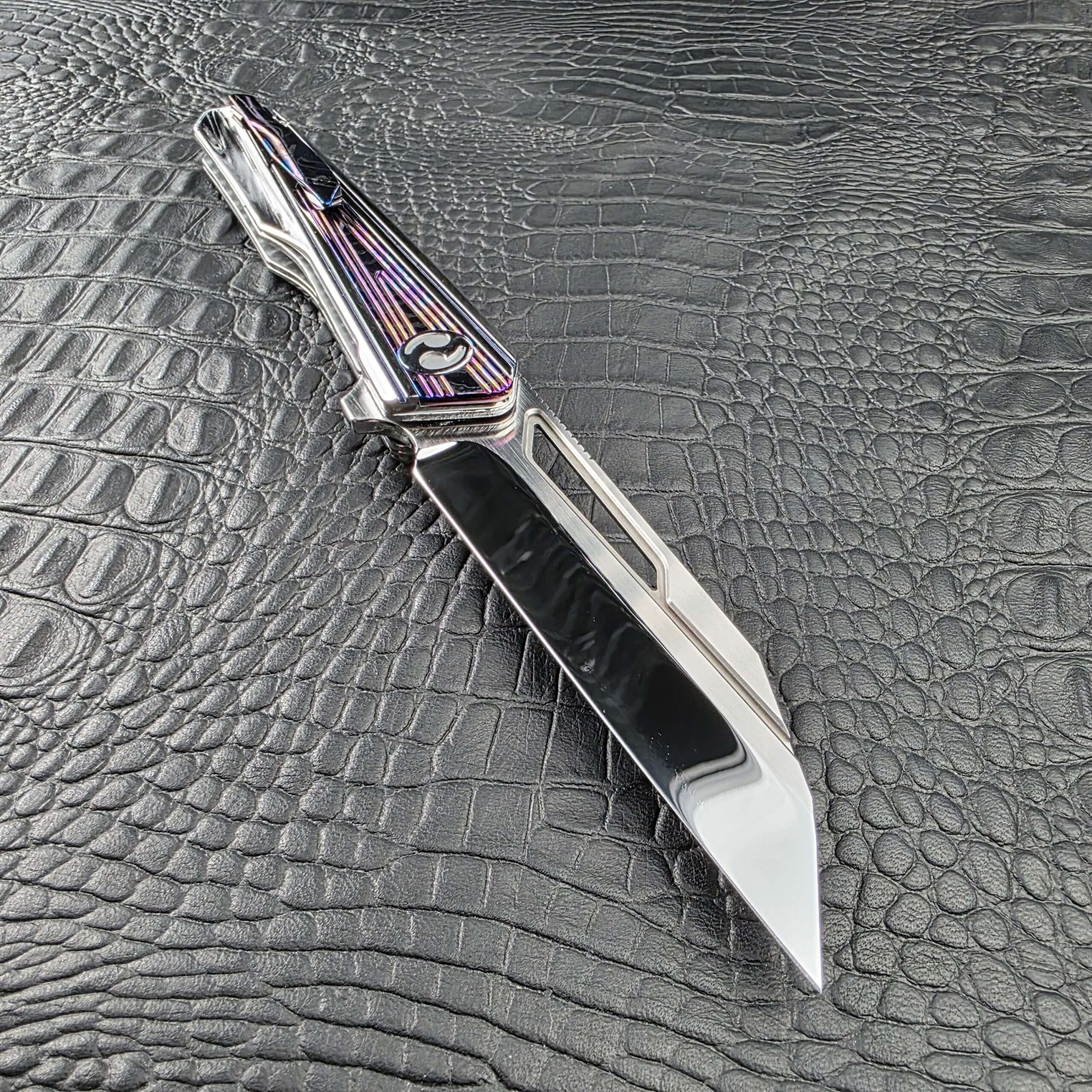 Elongated window milled through the high polish M390 blade of the Dew Hara Kabuki