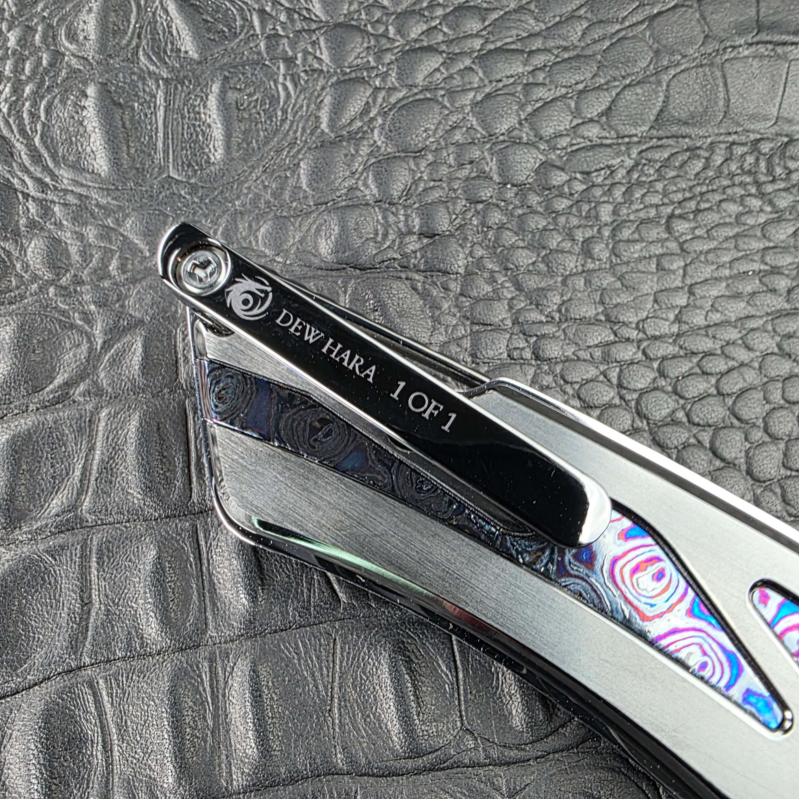 DLC Titanium pocket clip on the Dew Hara Ray engraved with the Dew Hara logo and DEW HARA 1 OF 1