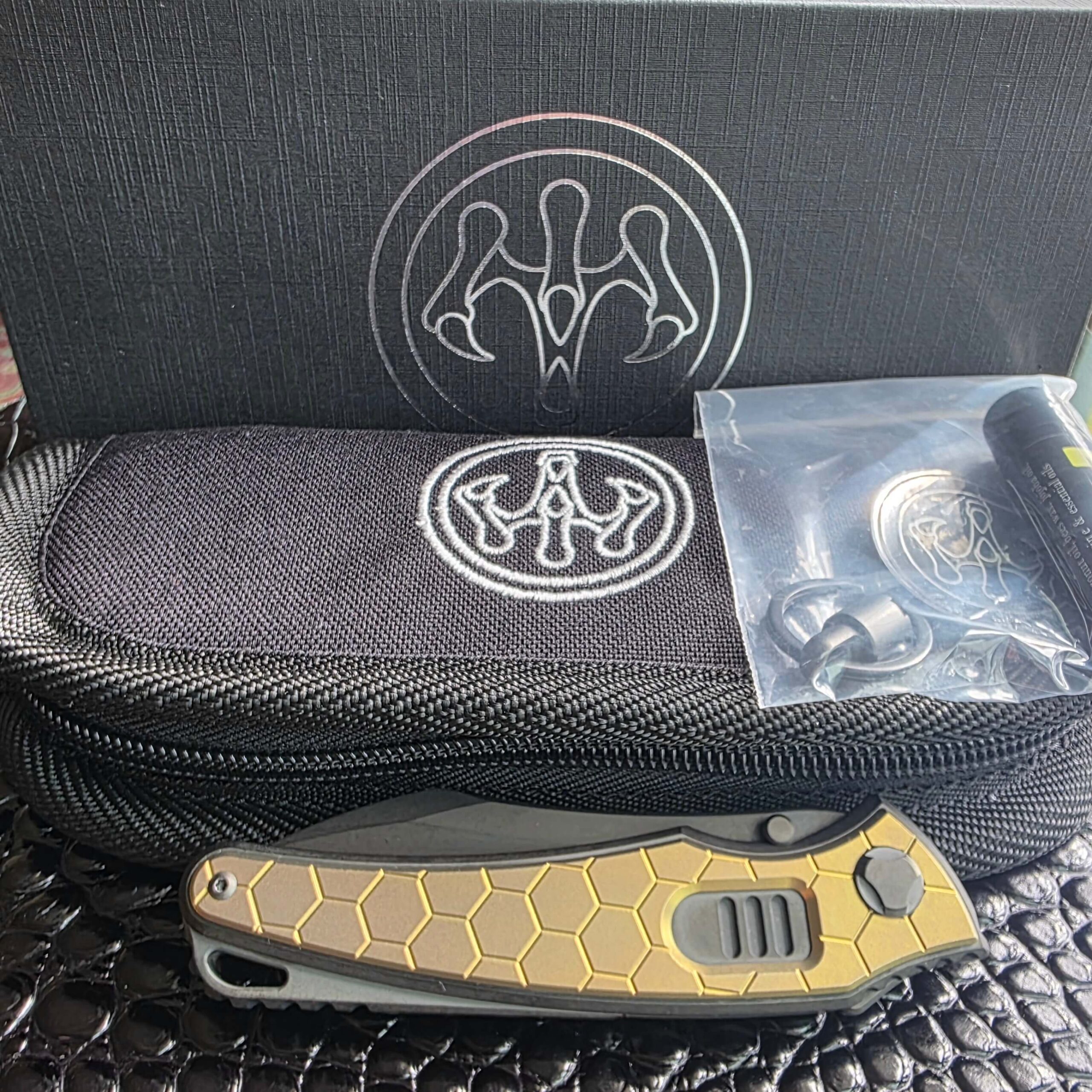 Complete Hawk Knife Designs factory kit with the Talon Auto, zippered pouch, pivot tool and Hawk Balm