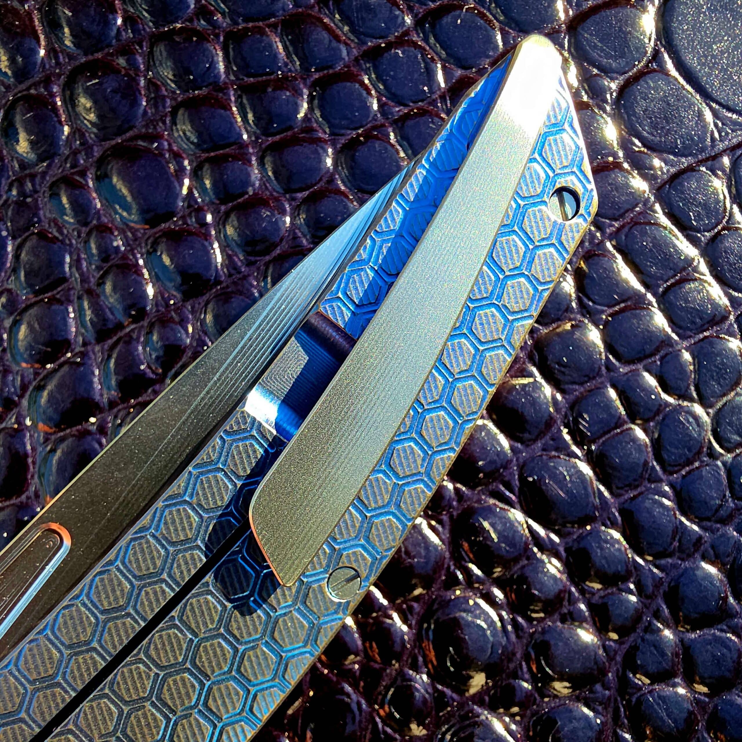 Profile of the deep-carry titanium clip on the closed Hog House Honeycomb Model T Gen 2