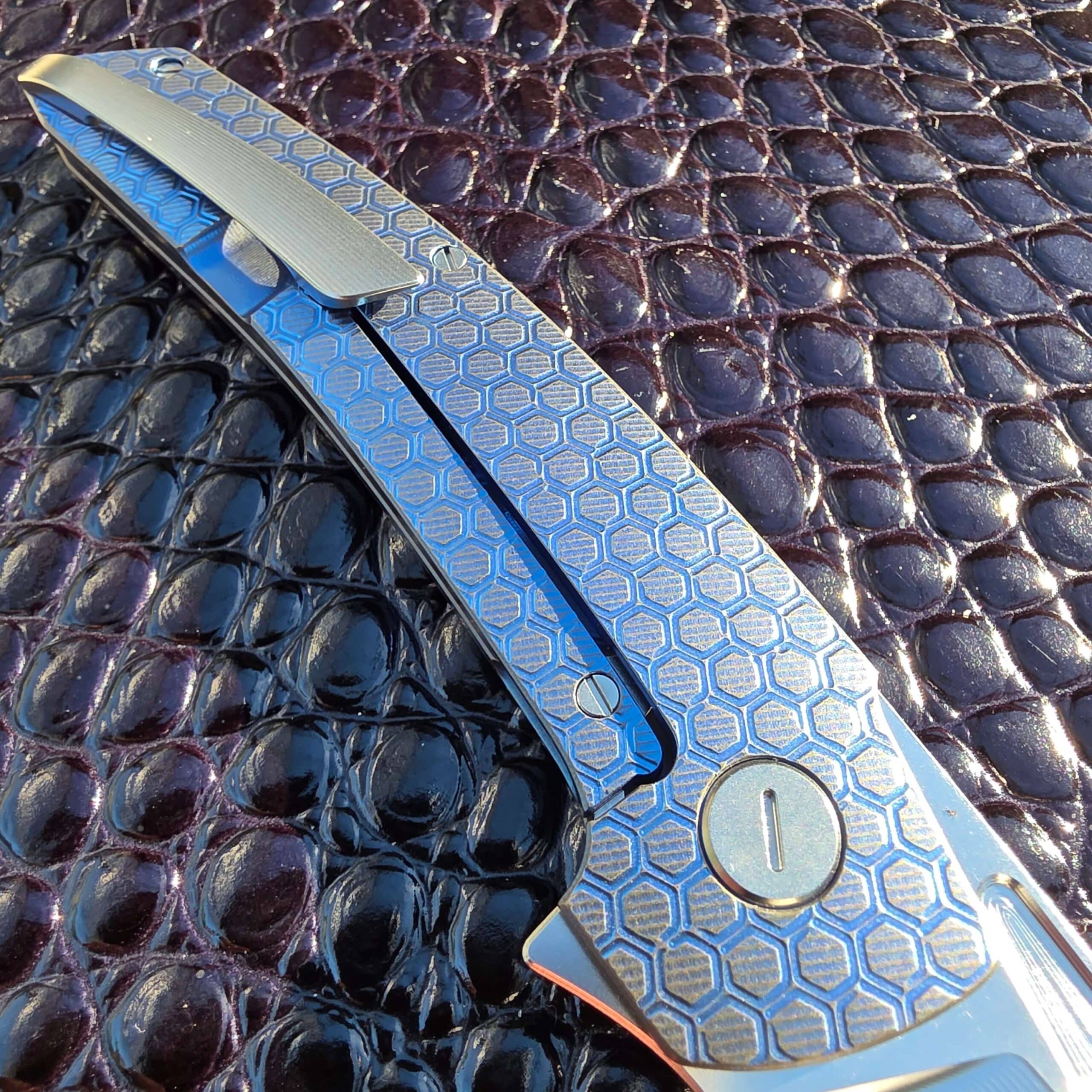 Macro of the 3D-milled titanium deep-carry pocket clip on the Hog House Honeycomb Model T Gen 2