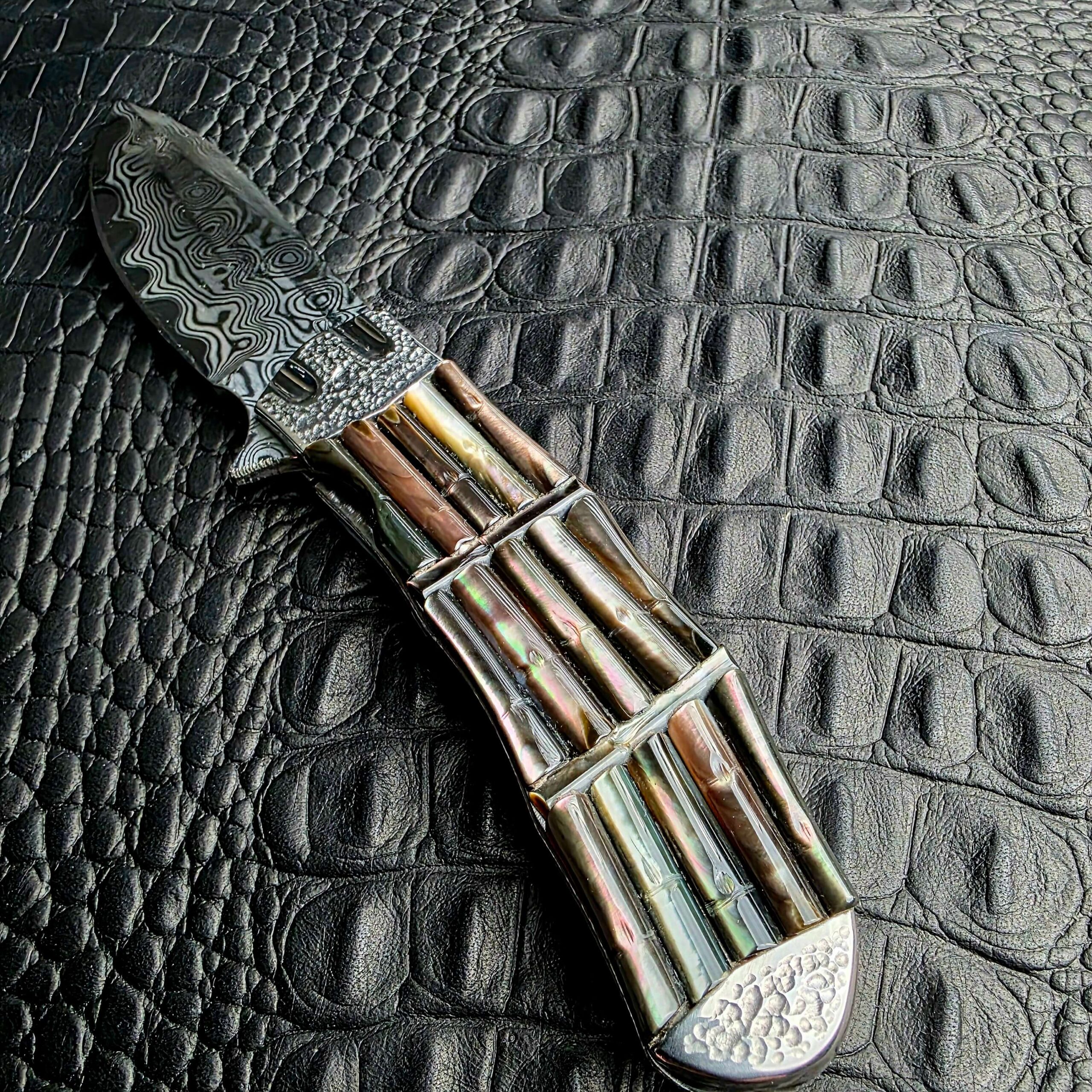 Full carved bamboo handle and rear tsuchime bolster of the Koji Hara Take Flipper