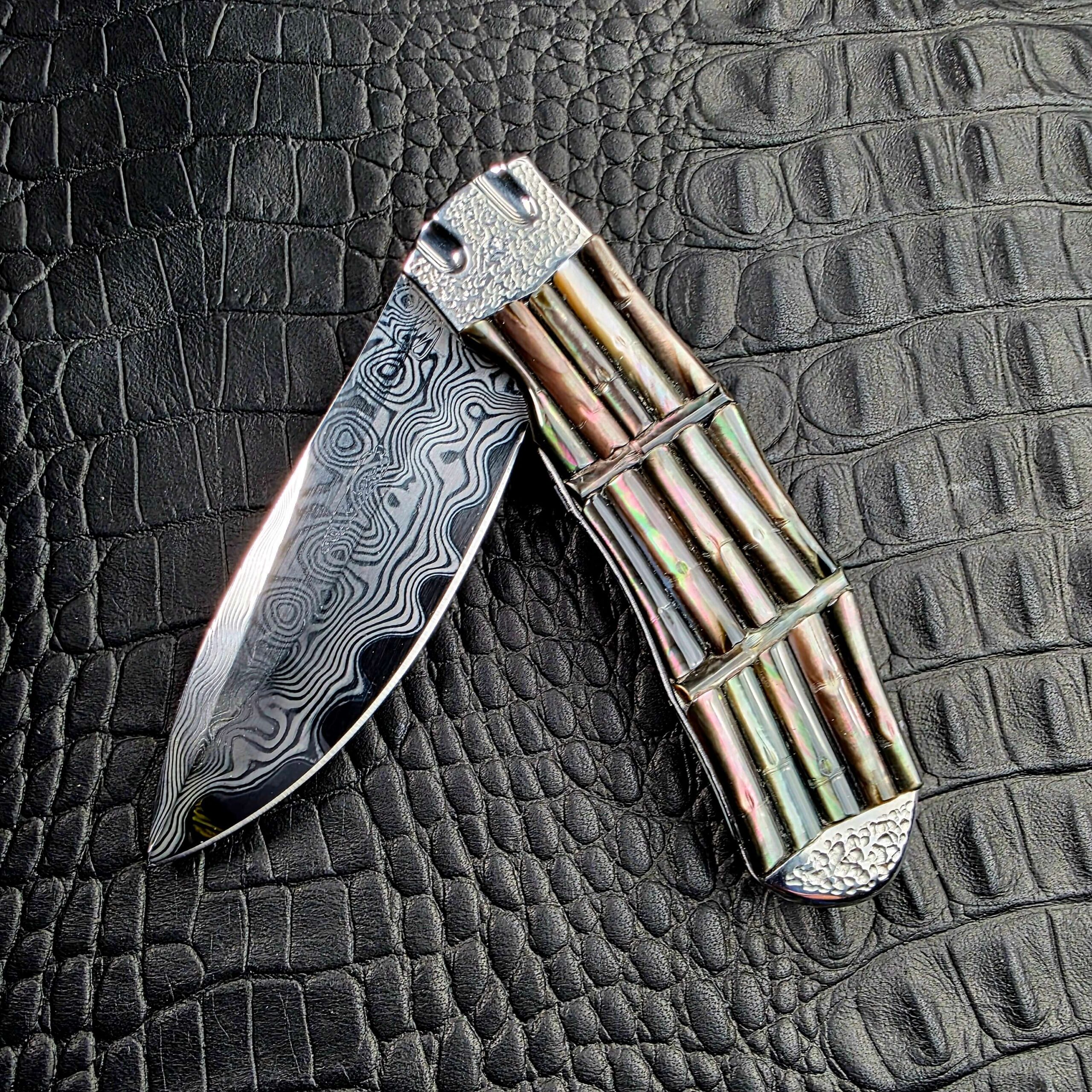 Koji Hara Take Flipper with the Damascus blade half open, show side