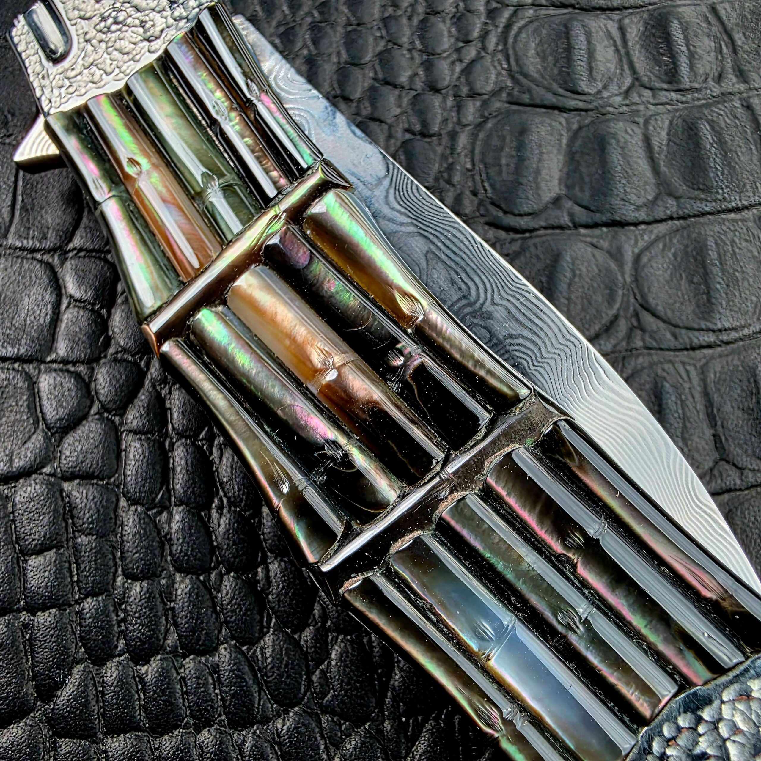 Hand carved Black Lip Mother of Pearl scales shaped as bamboo shoots on the Koji Hara Take Flipper