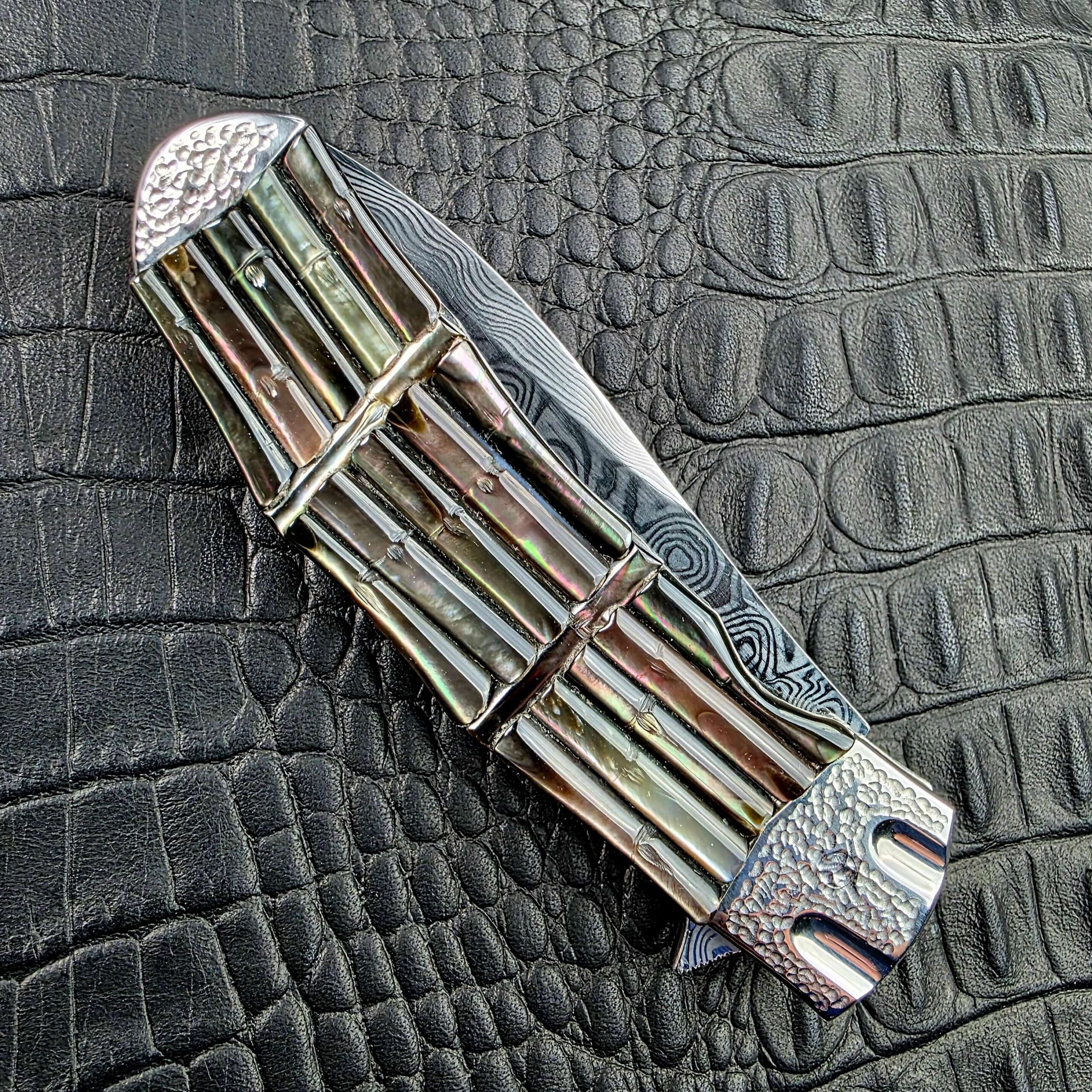 Closed Koji Hara Take Flipper on its show side with the carved bamboo scales