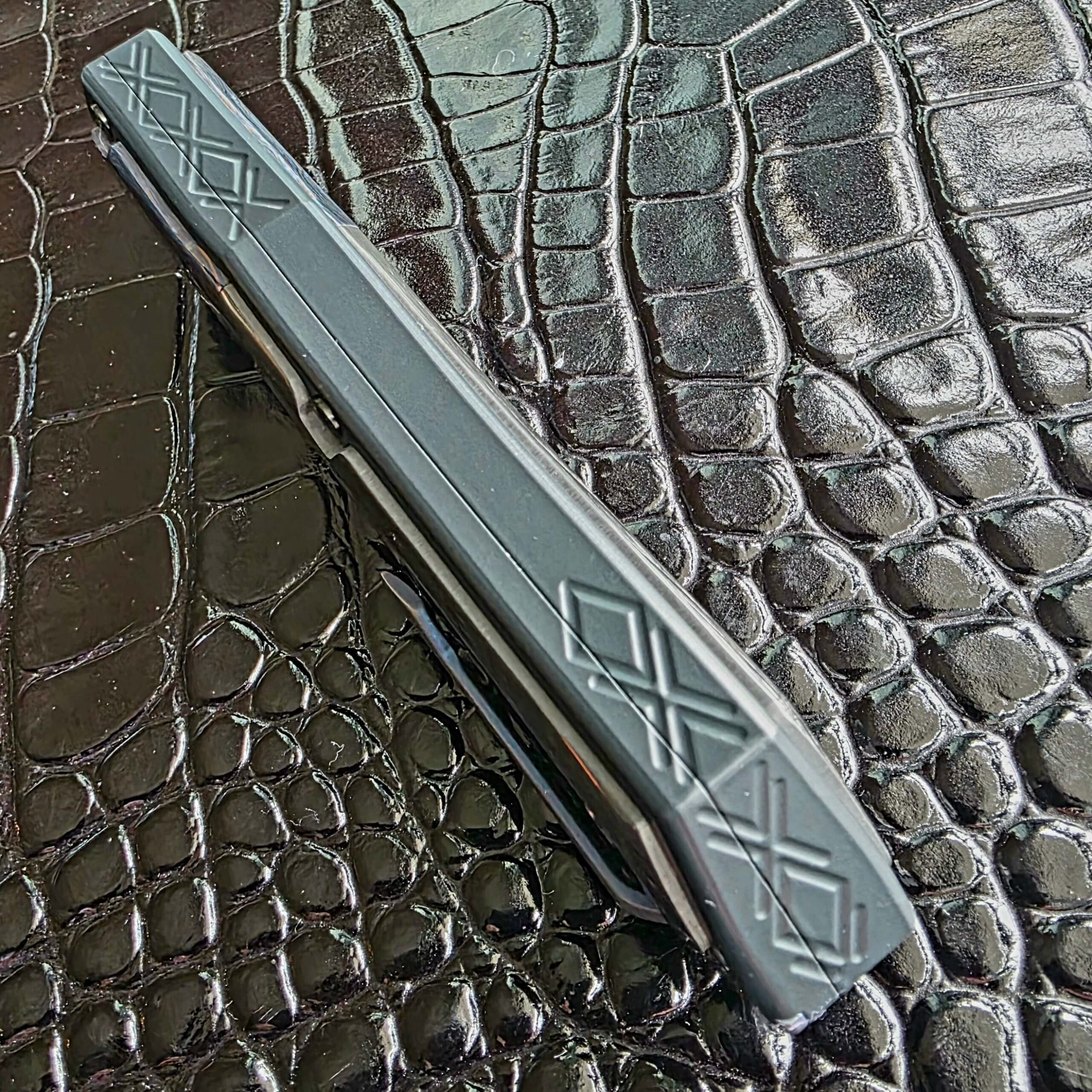 Milled diamond and X line work along the ceramic-treated spine of the Patrick Famin GOTF Mini