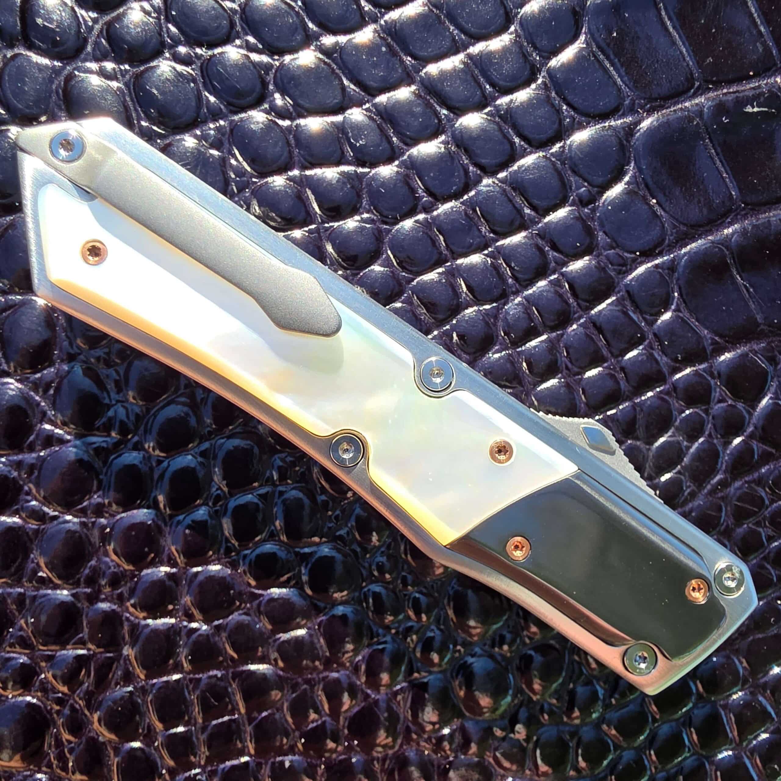 Patrick Famin Mother of Pearl G.O.T.F. Mini closed, clip side, full length with the titanium pocket clip
