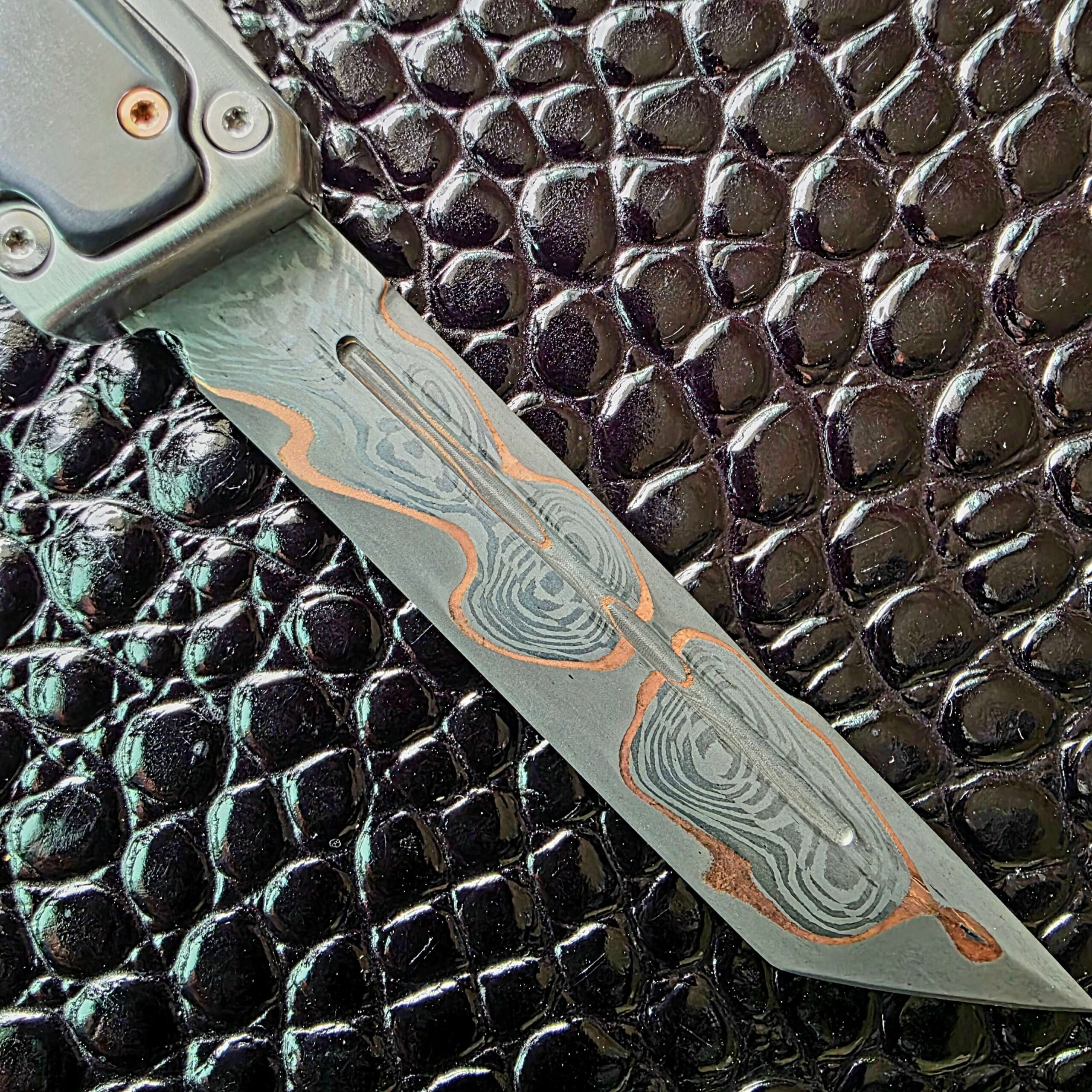 Fuller and copper seam detail on the Baker Forge CopperMai blade of the Patrick Famin Mother of Pearl G.O.T.F. Mini