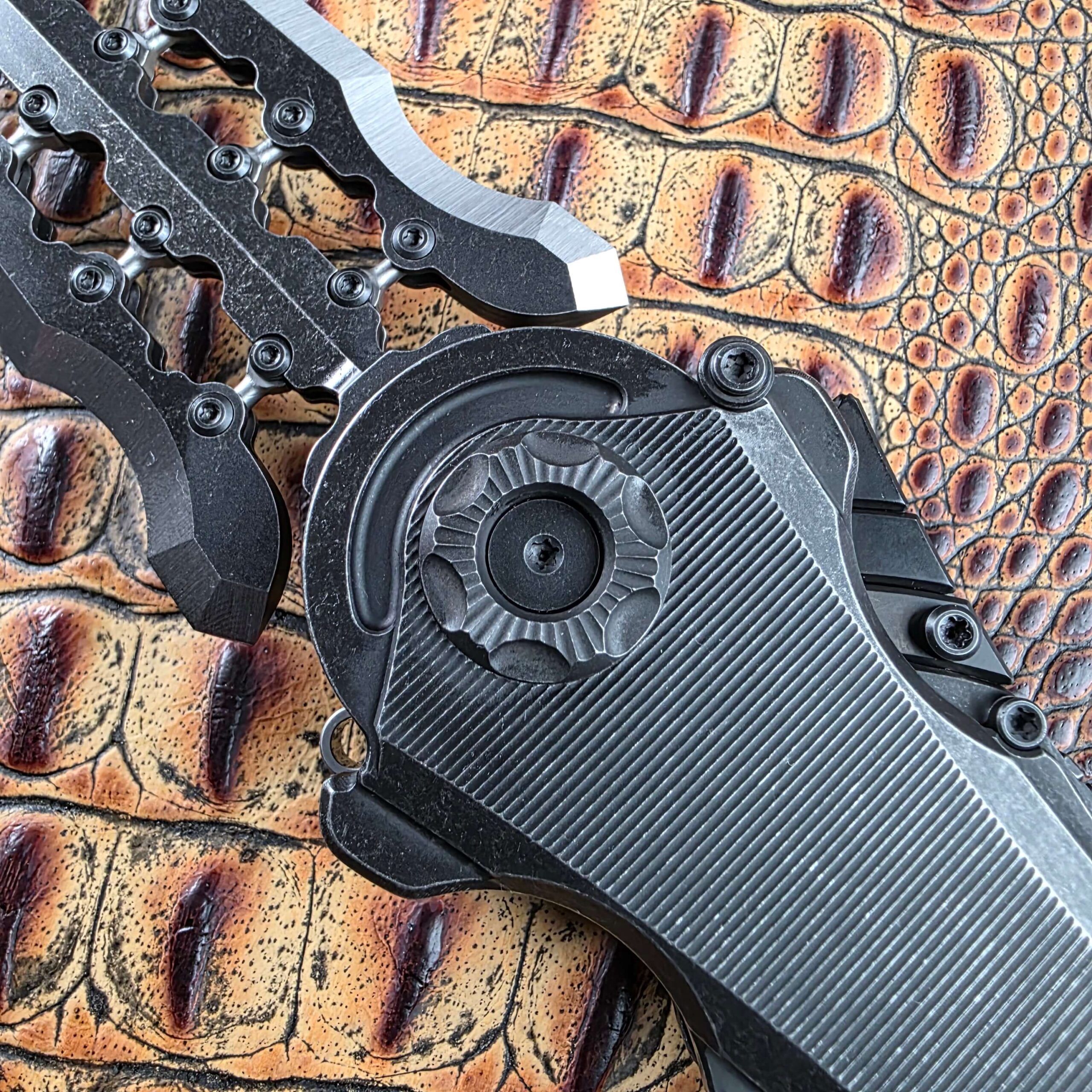 Macro of the Poikilo Blade AL-Khem rotating pivot ring with petal relief and radial fluting