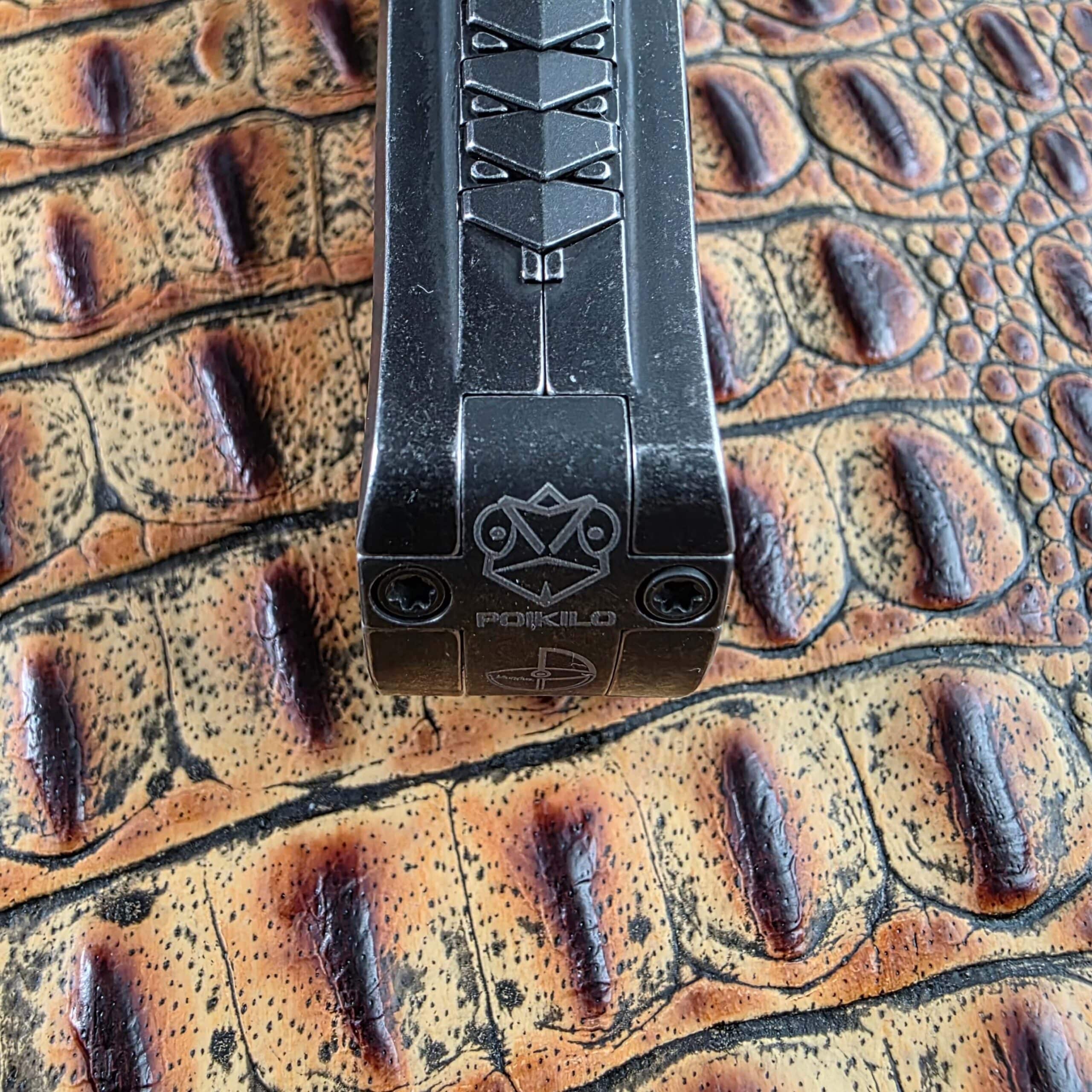 Macro of the POIKILO engraving and maker’s mark on the Poikilo Blade AL-Khem pommel