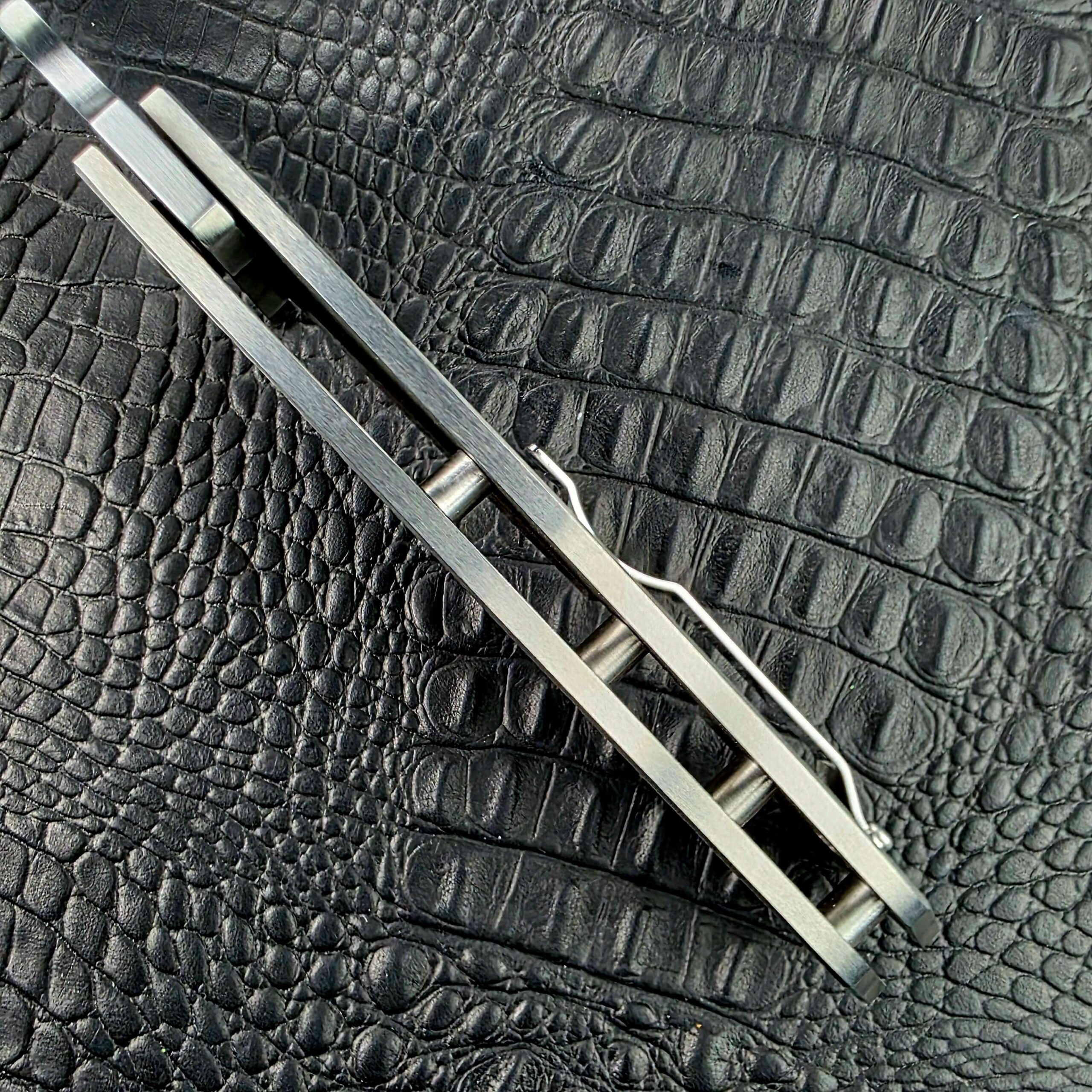 Open back of the Reese Weiland Strike Prototype 2 with standoffs between the Titanium frame halves