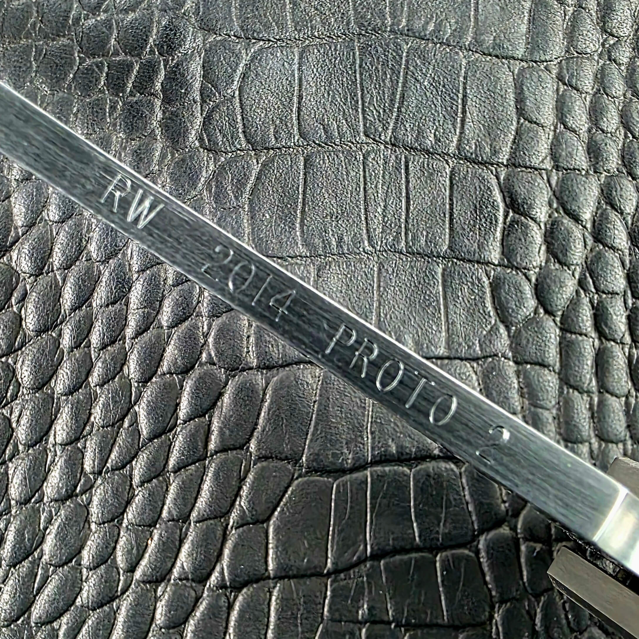 RW 2014 PROTO 2 engraved on the blade spine of the Reese Weiland Strike Prototype 2