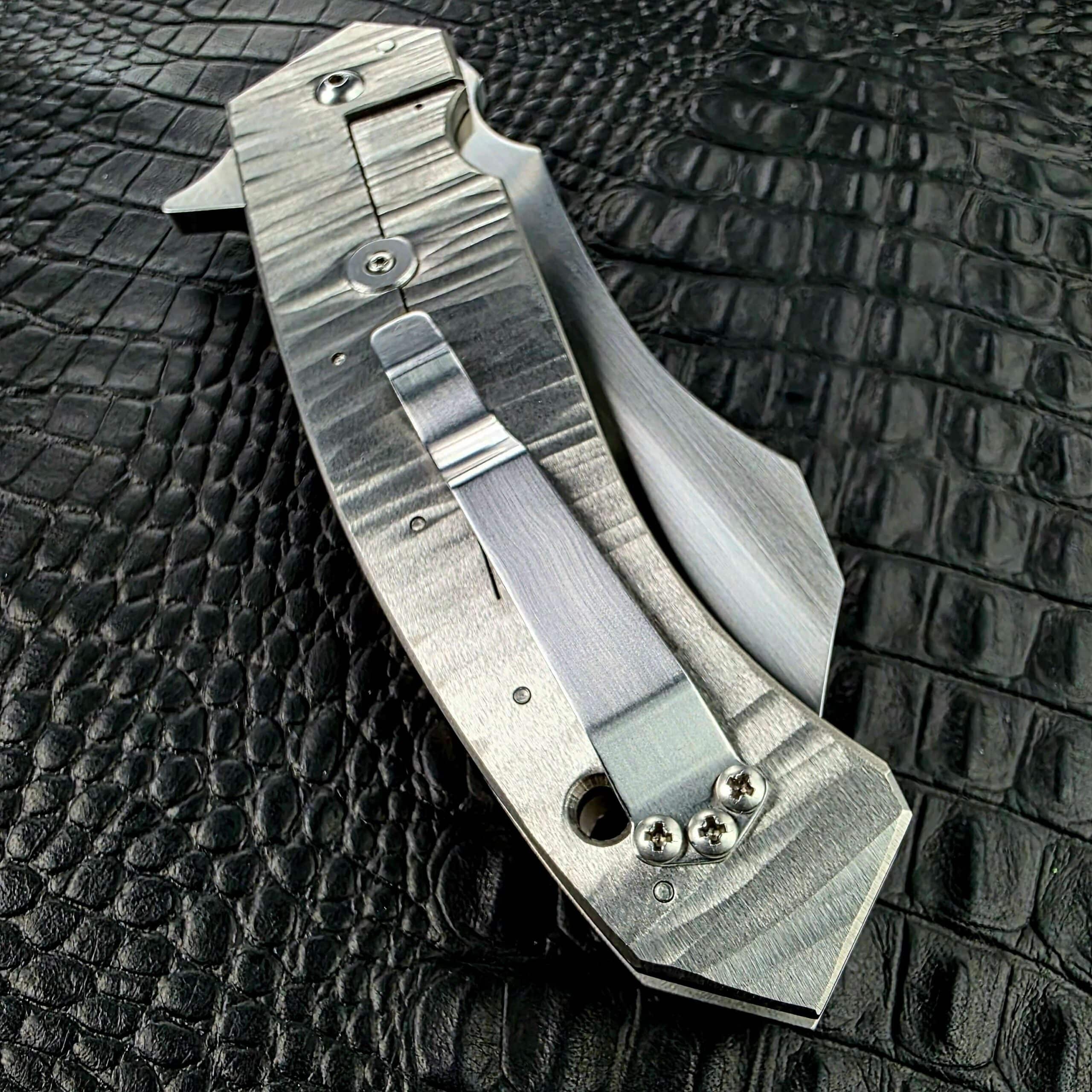 Titanium frame lock bar on the closed Reese Weiland Strike Prototype 2, angled view